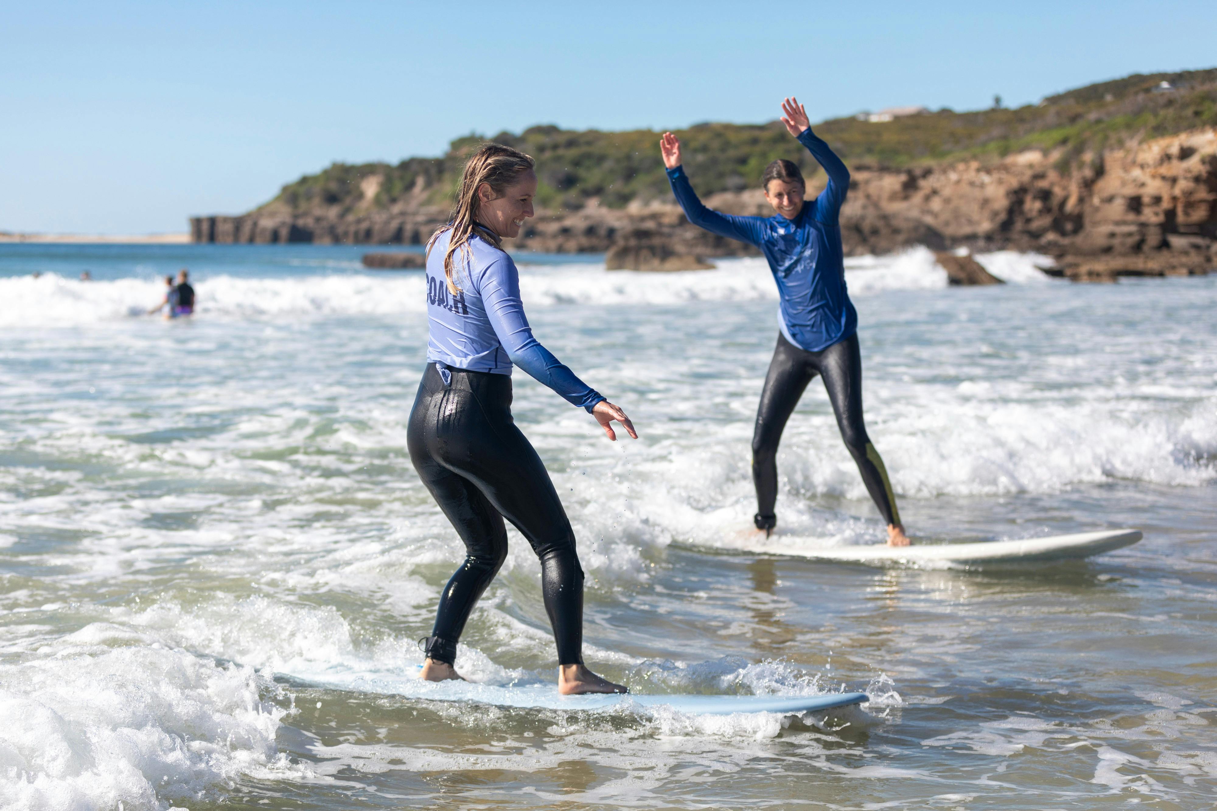 women surfing
