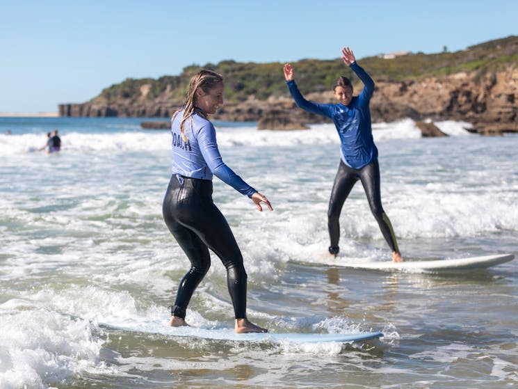women surfing