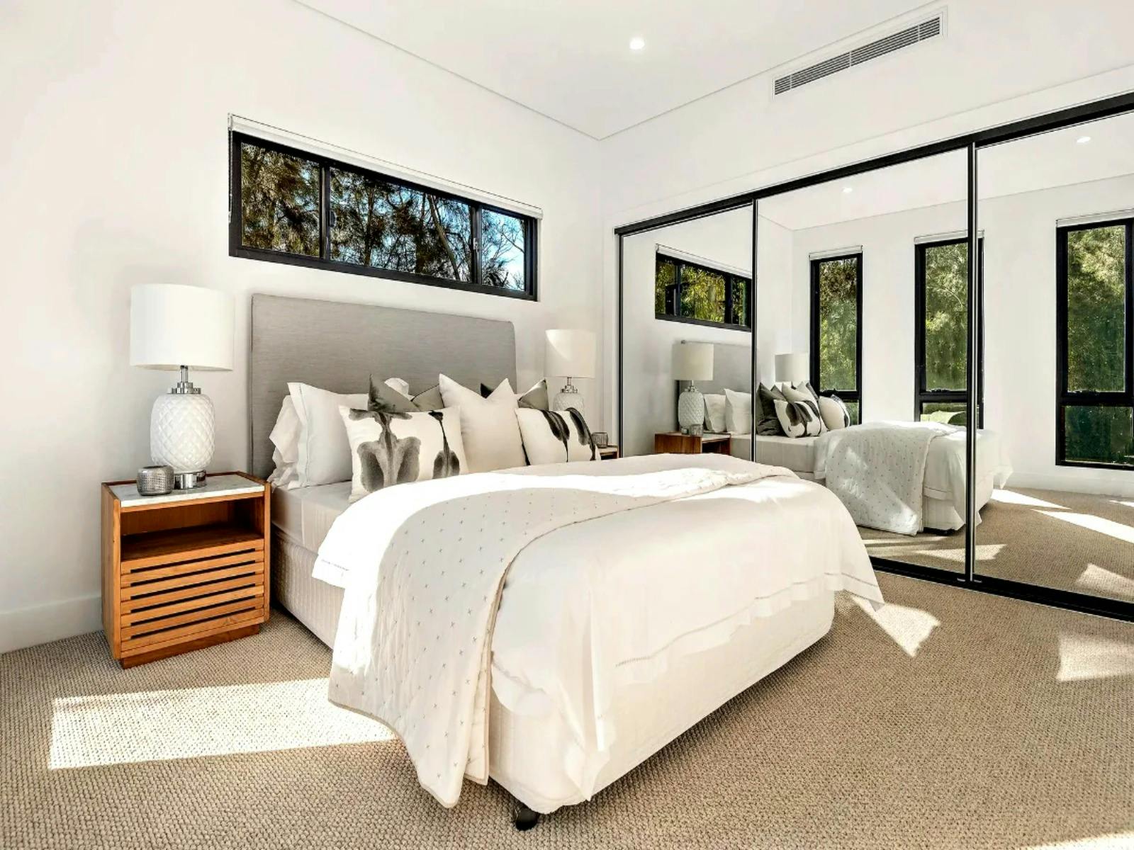 Stylish queen bedroom with ensuite