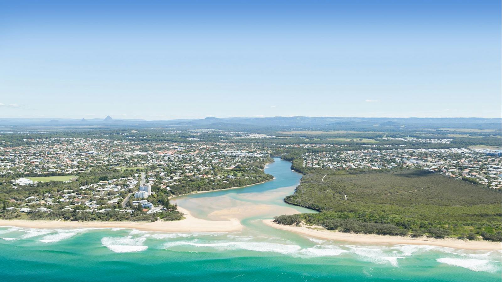 Currimundi River outlet views from Seaplane with Glasshouse Mountains in far distance