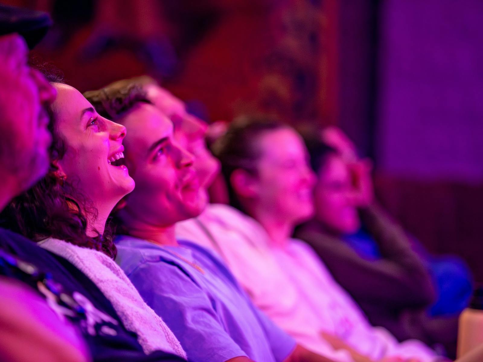 Cloe up of crowd watching comedy shows and laughing