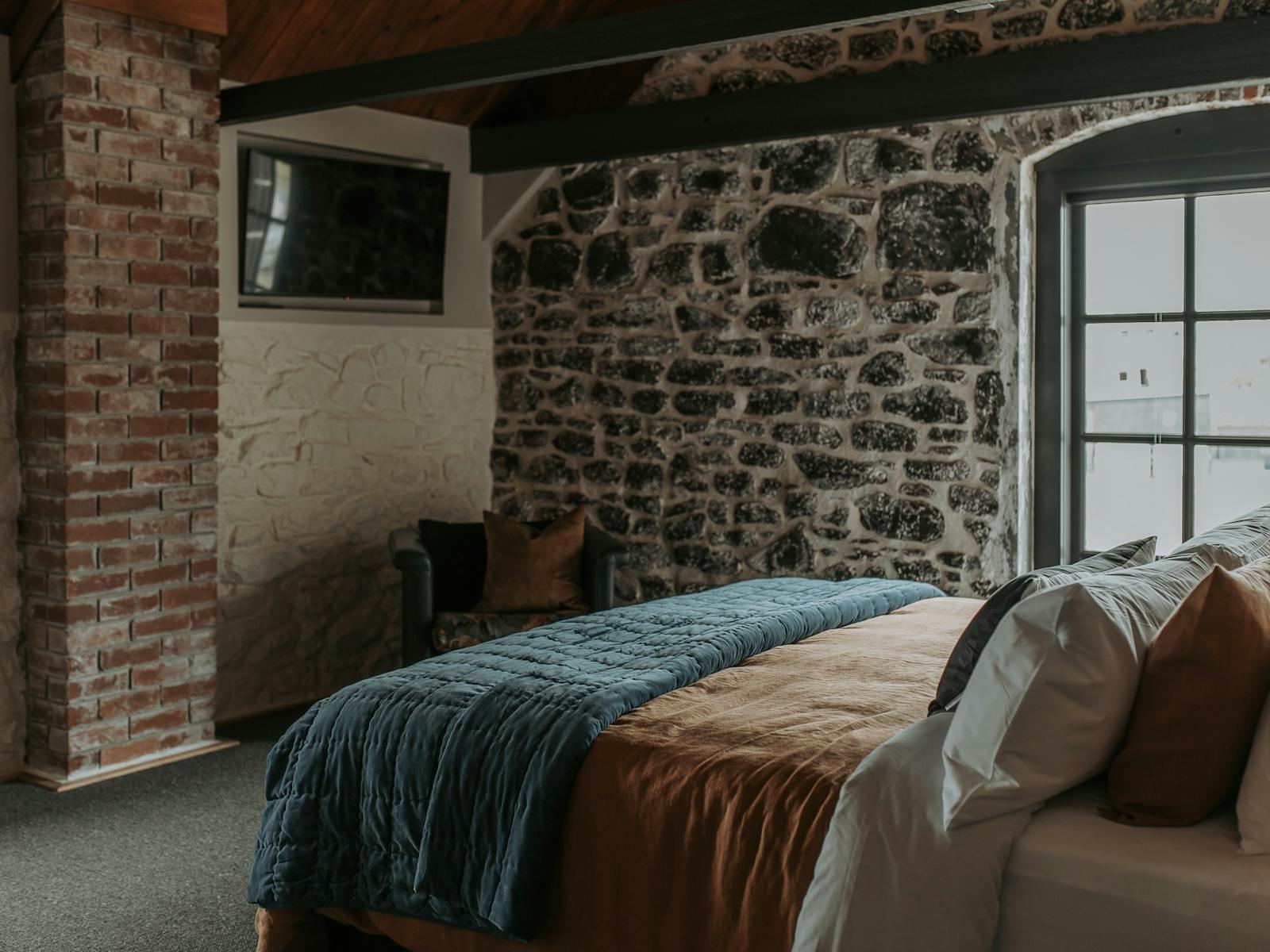 King size bed, views from the bed looking out to the sea, large bathroom, television, wardrobe