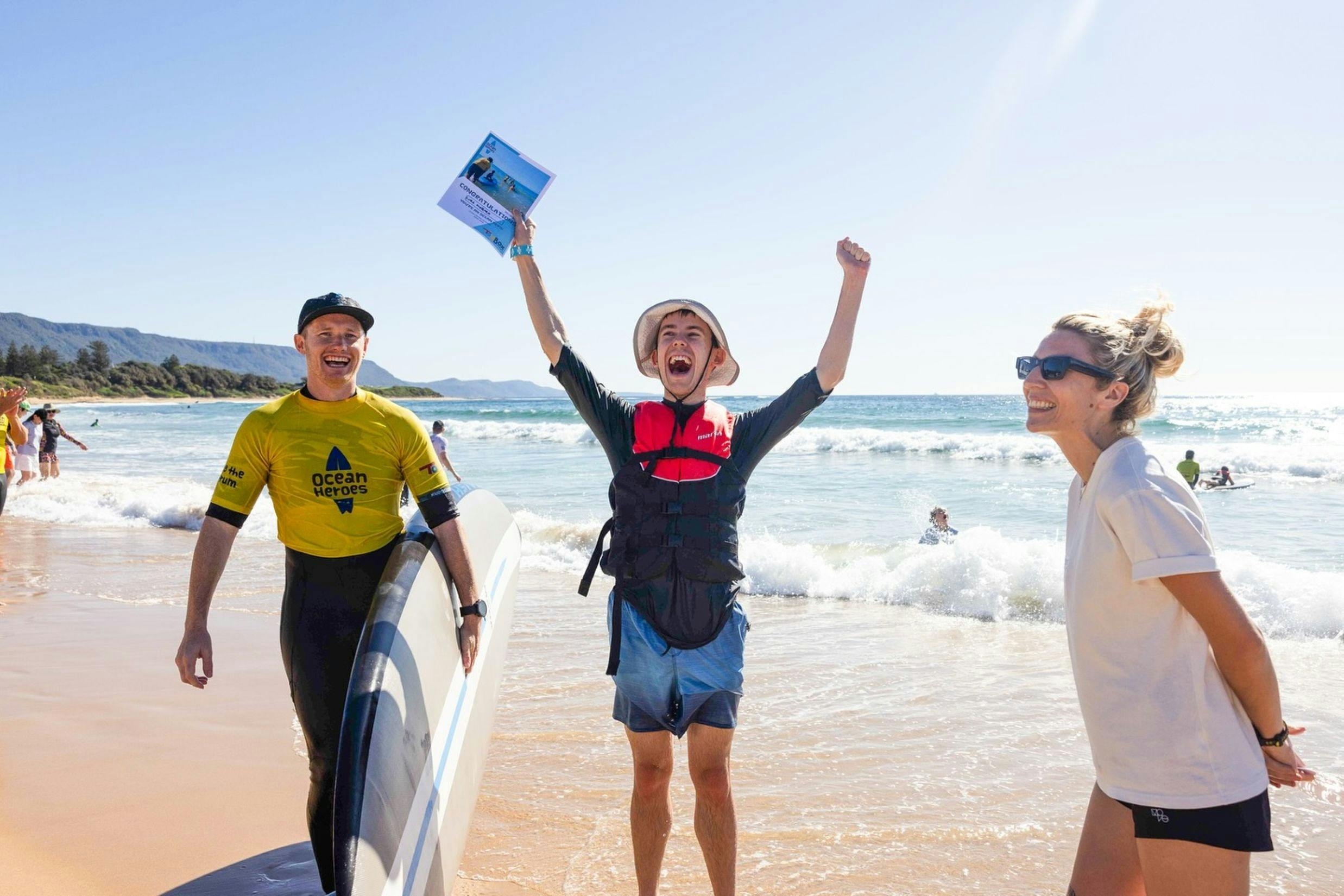 teenager with his surfing instructors