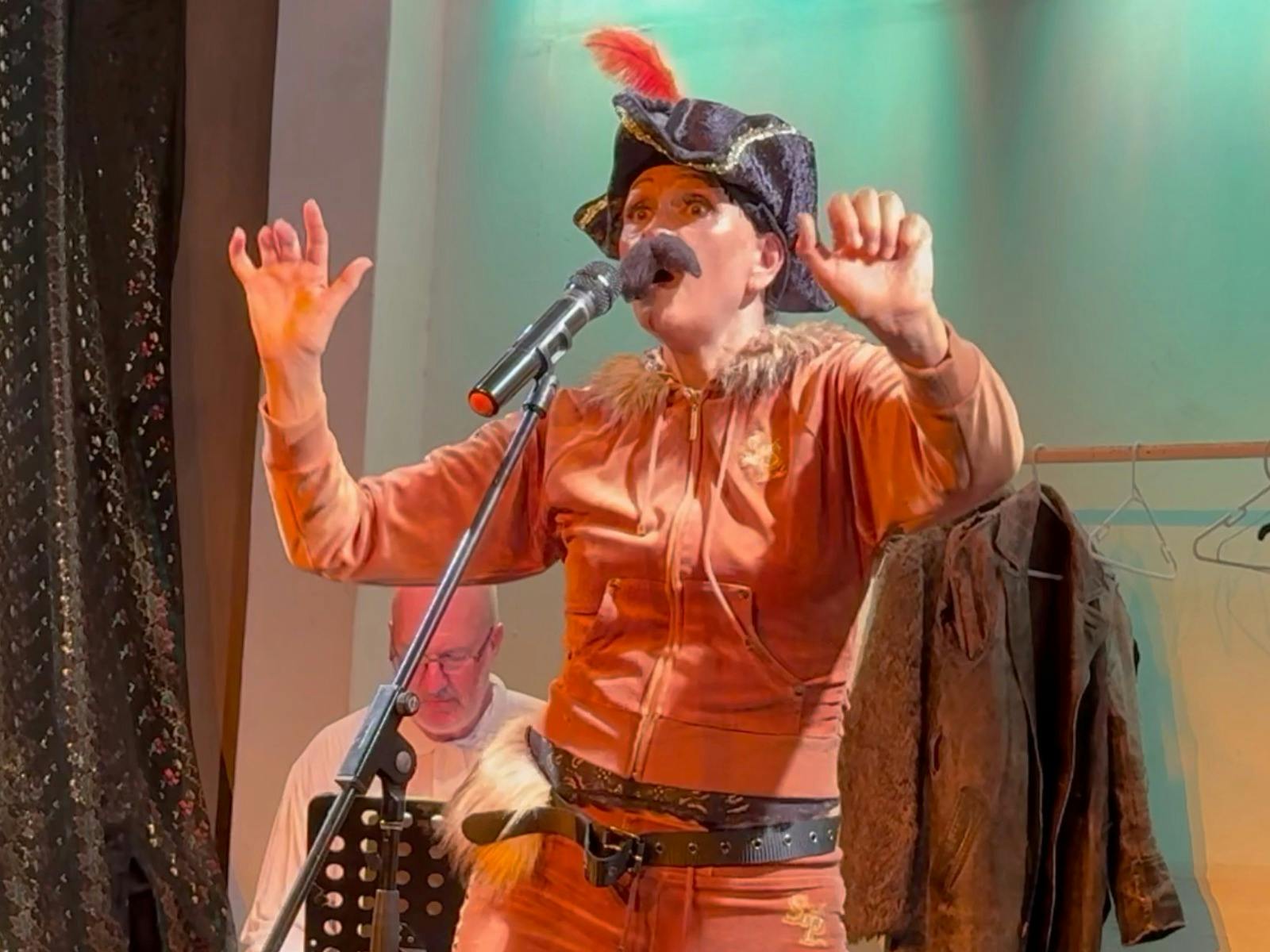 Woman in Tracksuit pans and hat pretending to be a cat