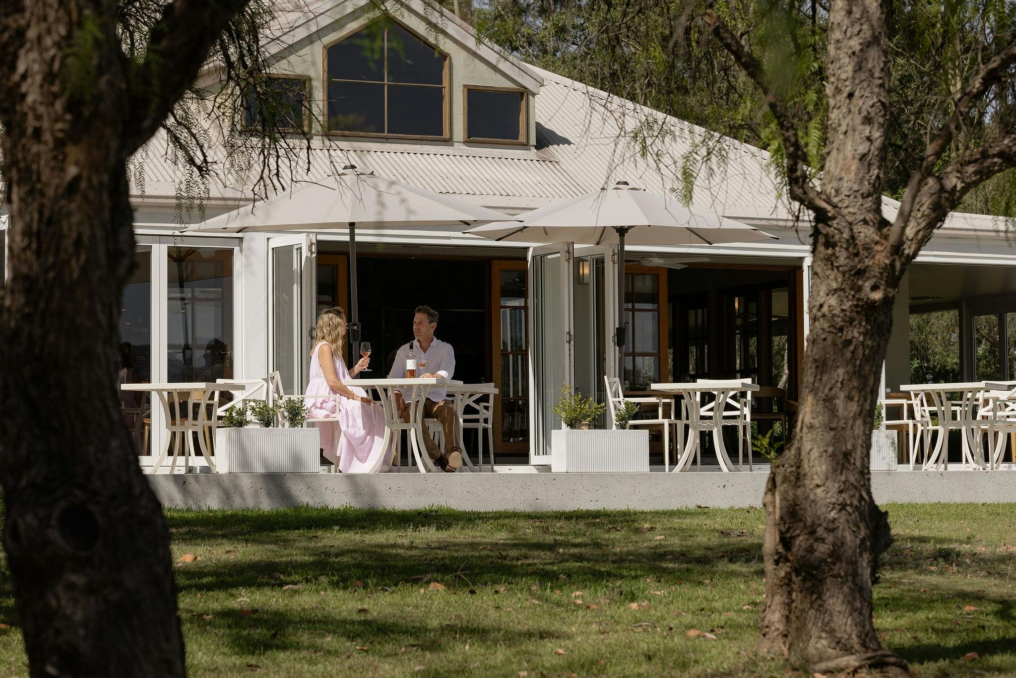 Couple enjoying a meal in the Restaurant Botanica verandah
