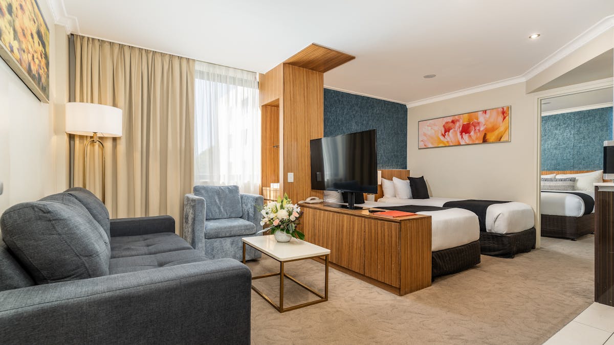 Family Suite, Main Room 1 Queen bed, Behind Lounge 2 single beds, Comfy Couch in sitting area Family Suite, Main Room 1 Queen bed, Behind Lounge 2 single beds, Comfy Couch in sitting area