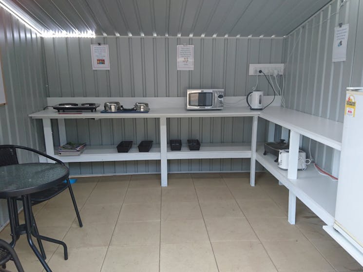 A small sheltered area for campers to cook and eat basic meals.