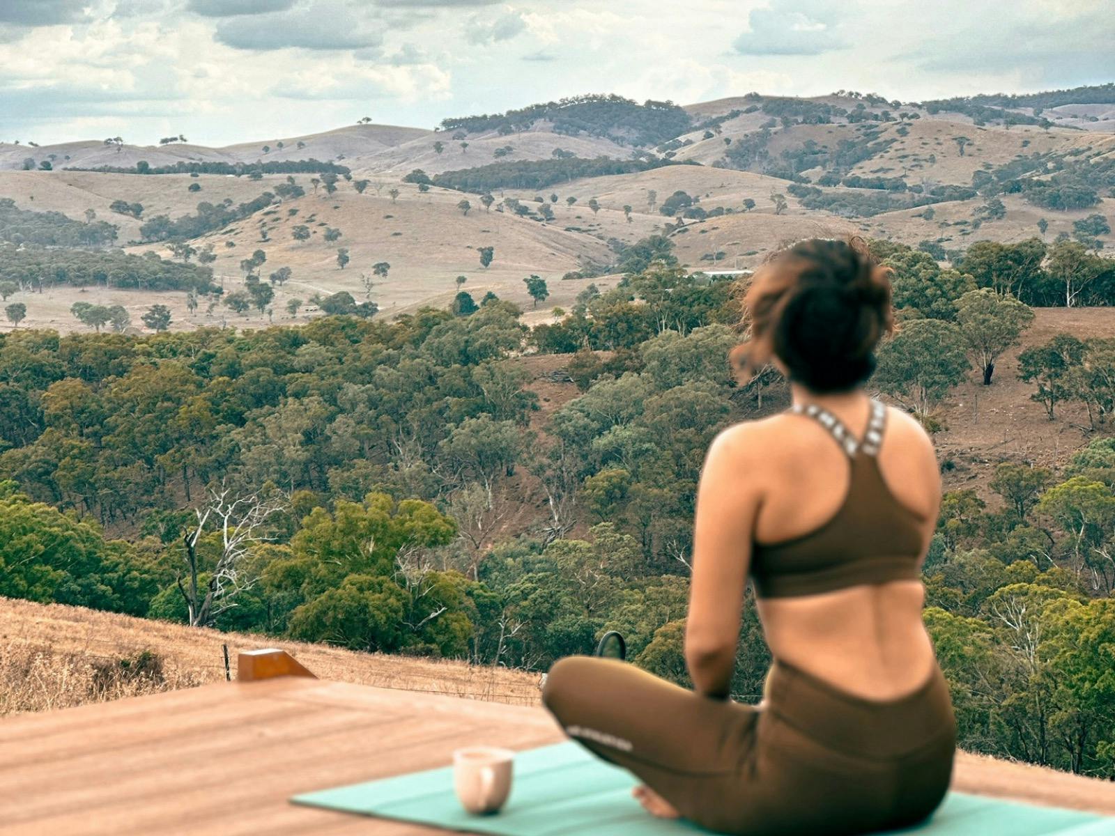 Guest enjoying yoga on outdoor deck