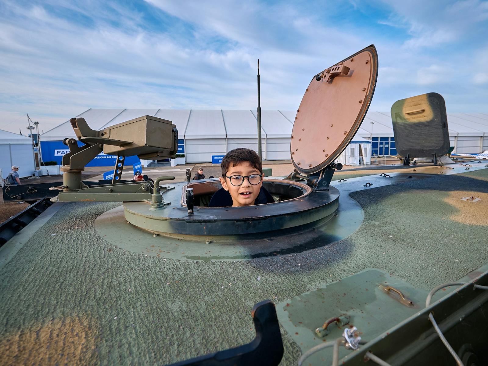 Child in a defence tank