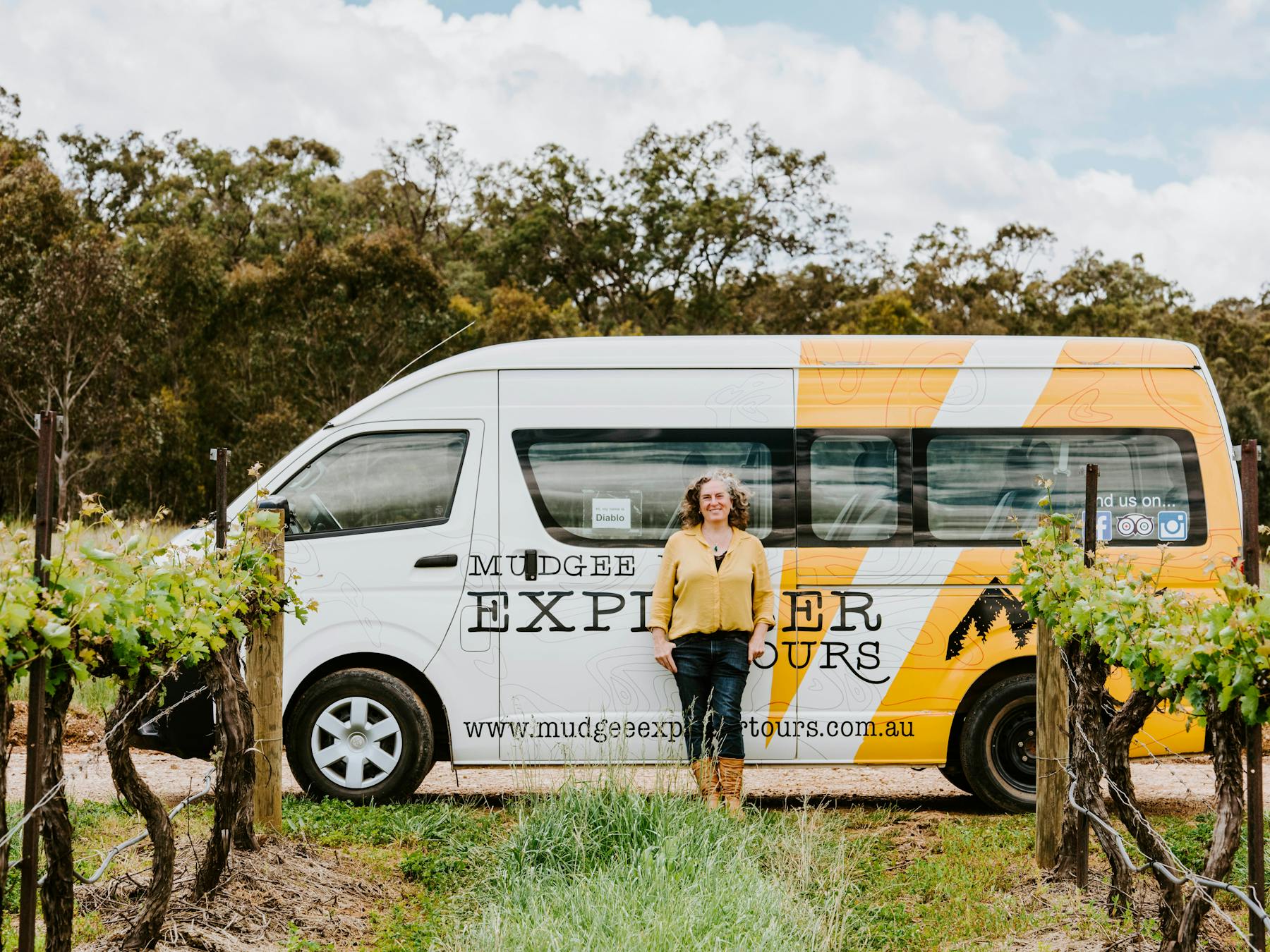 Bronny standing in front of a tour bus