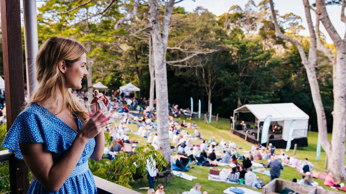 A woman looking over the pavilion to the lawn at Spicers Tamarind Retreat