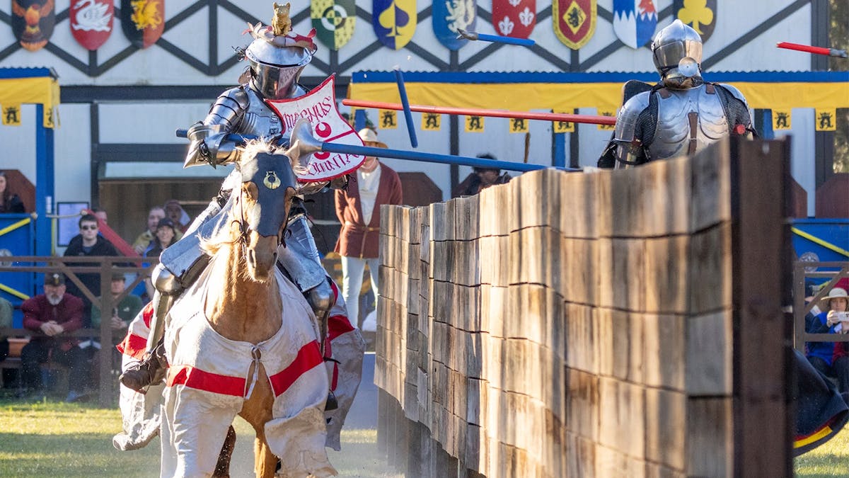two jousters pass each other with broken lances
