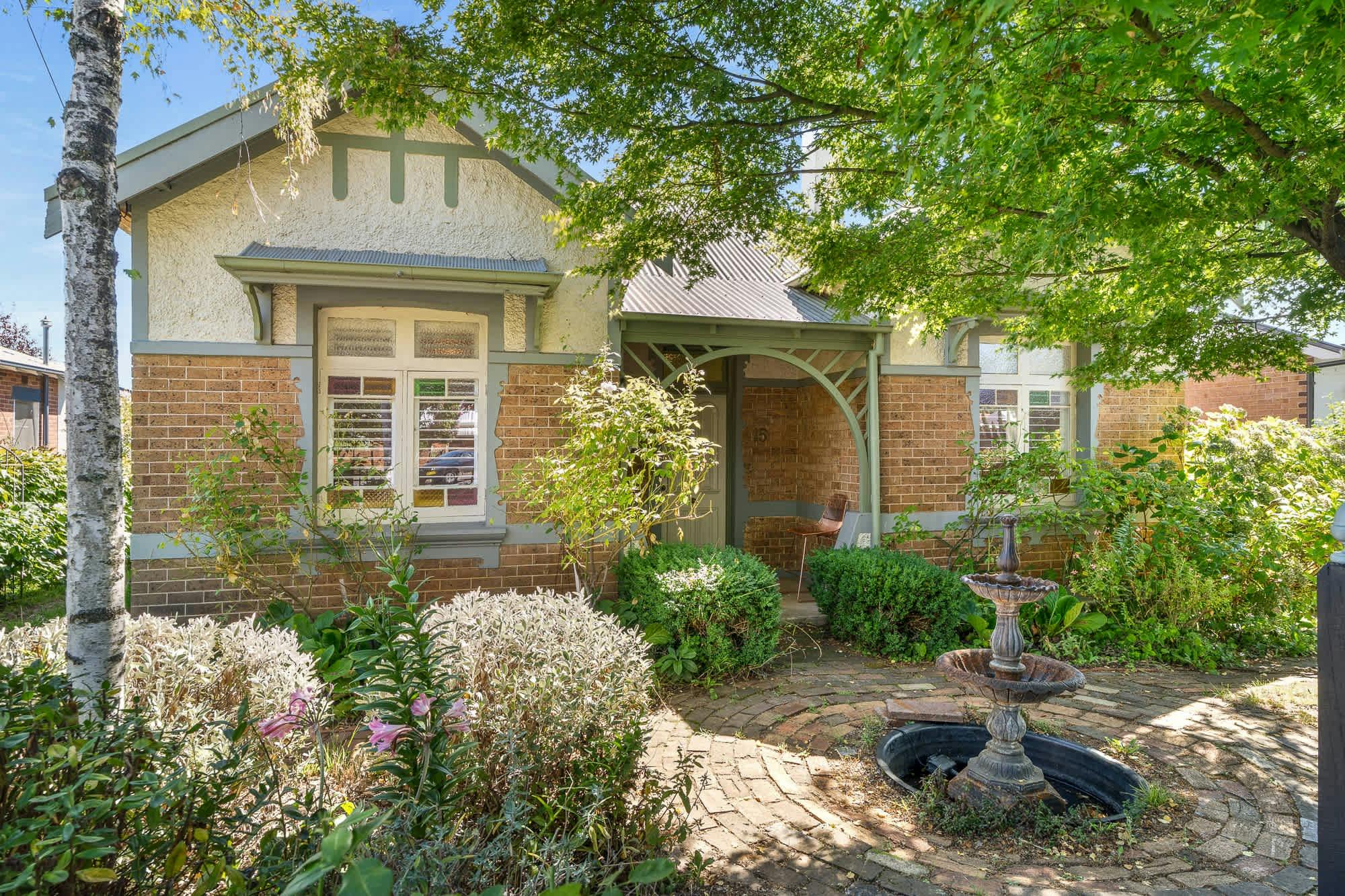 Front yard of heritage brick home on March st