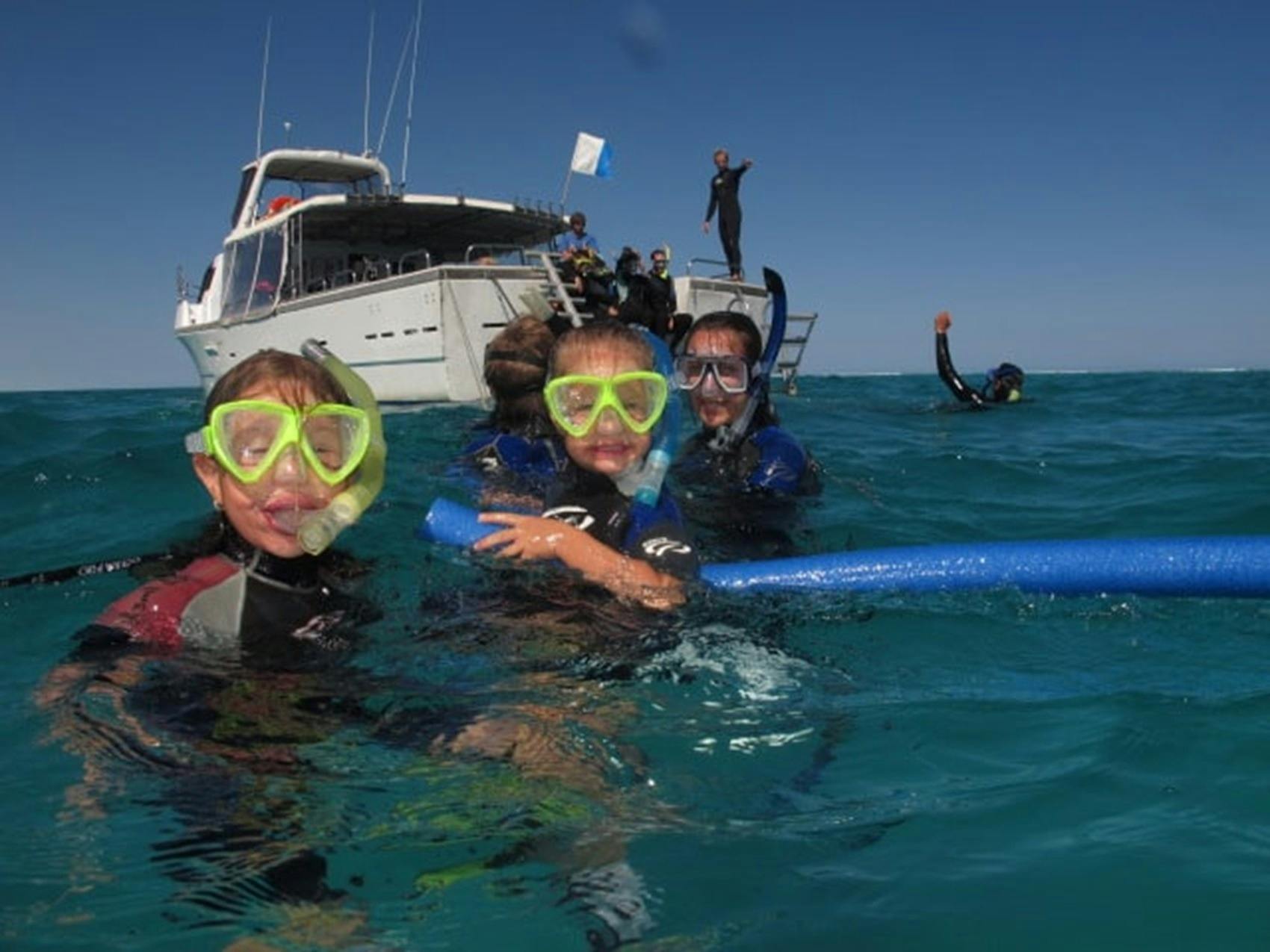 boat and snorkellers