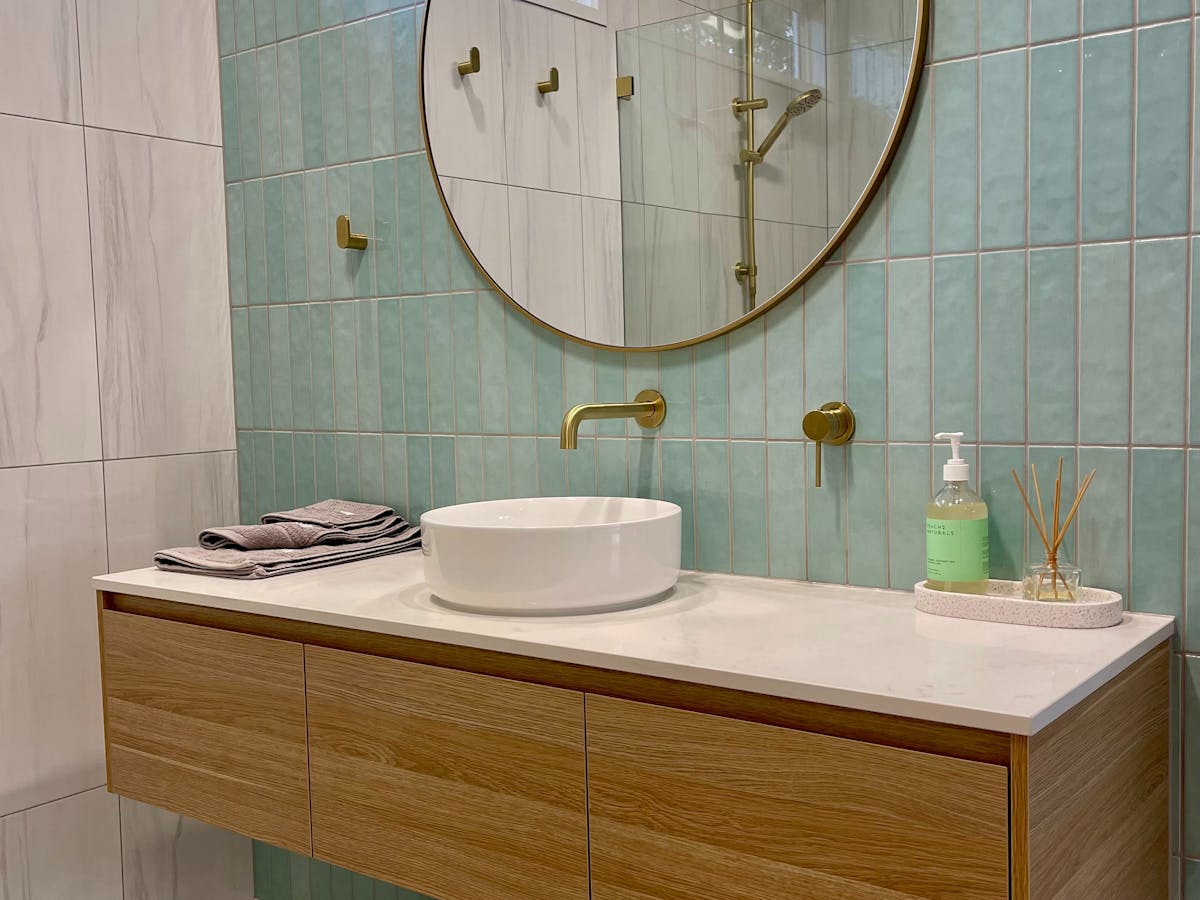 Bathroom with toilet that can be closed off for privacy with a barn door at Whispers, Glastonbury