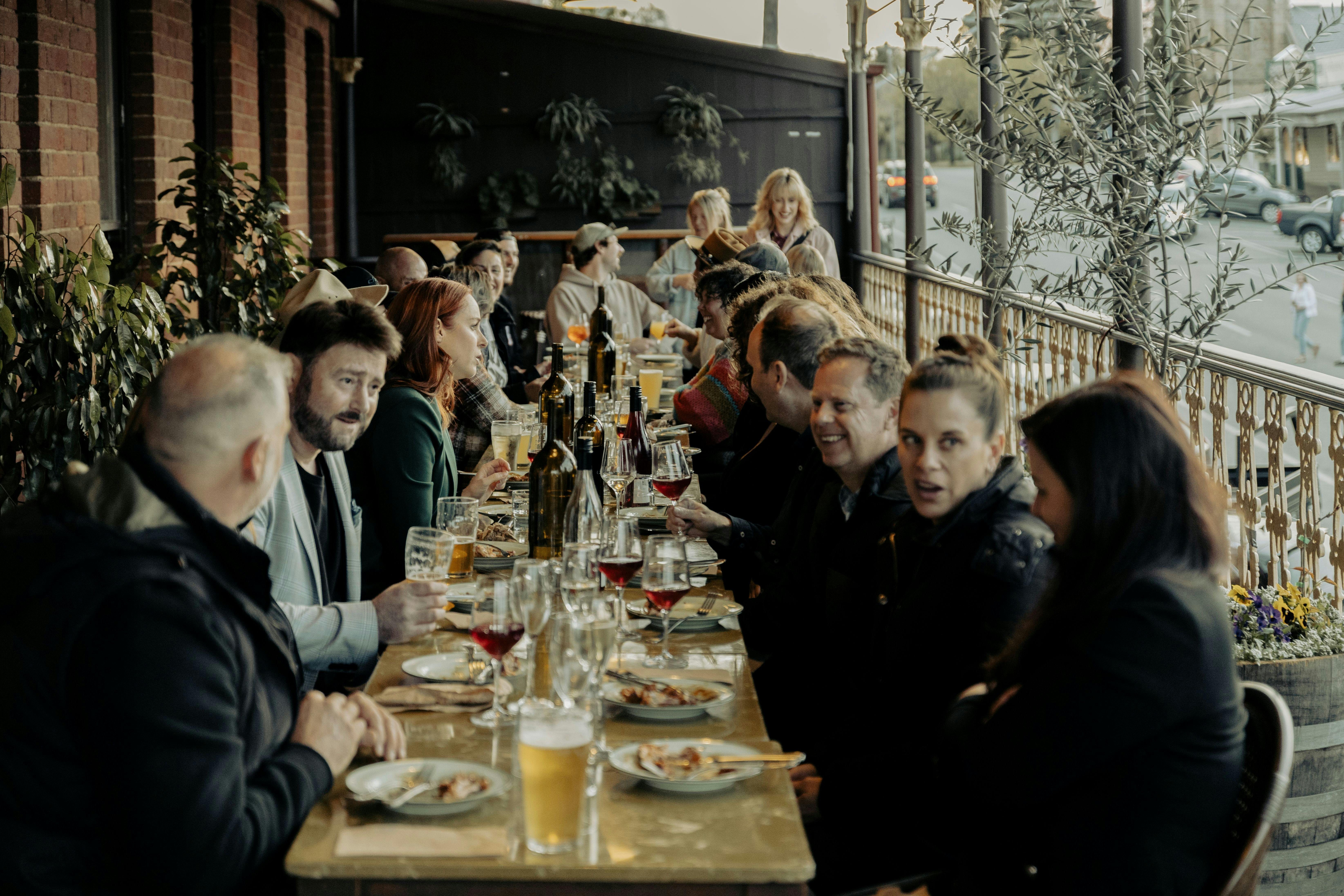 Group of Guests sitting on the terrace enjoying lunch.