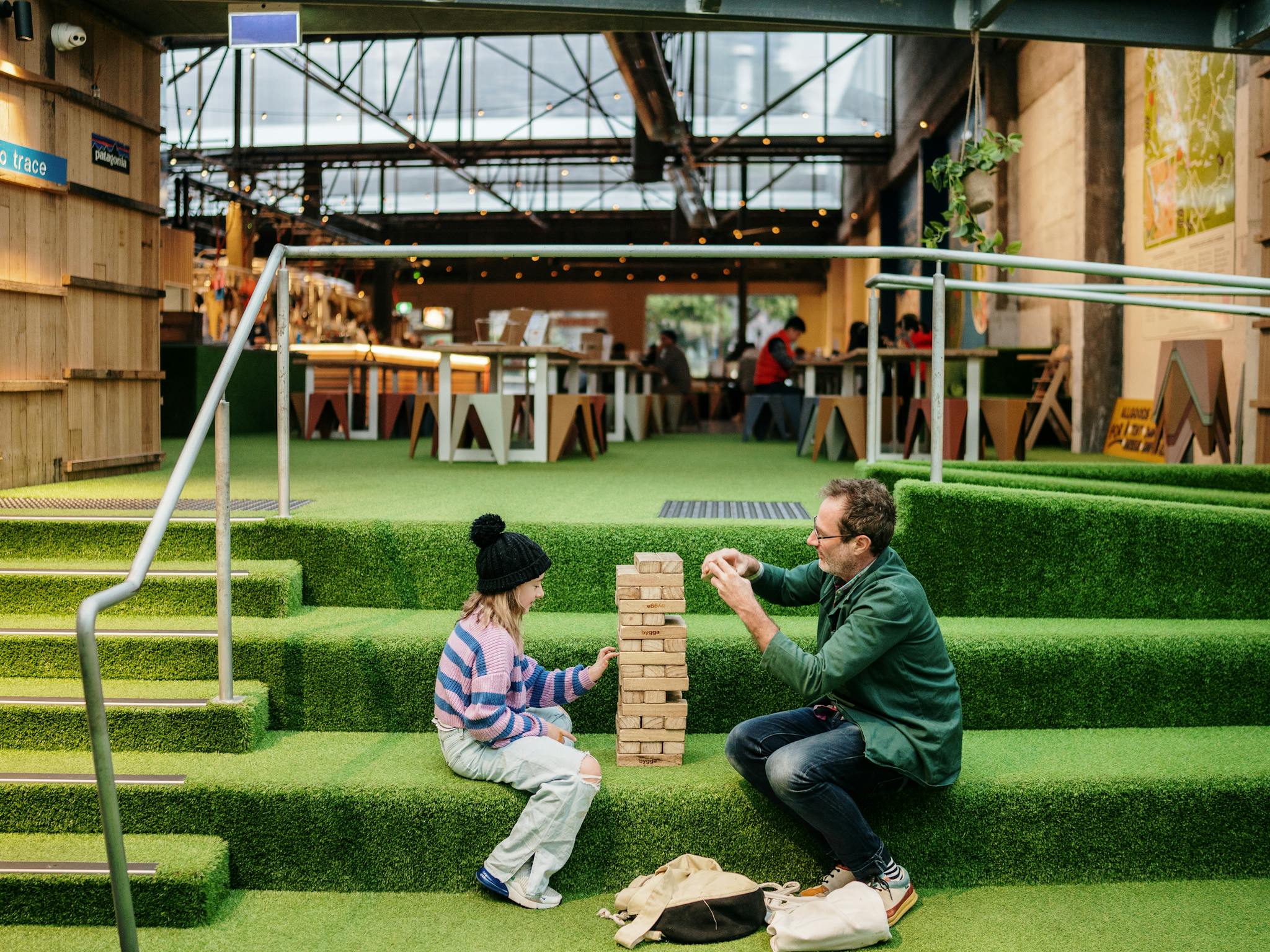 Child and adult sitting on steps