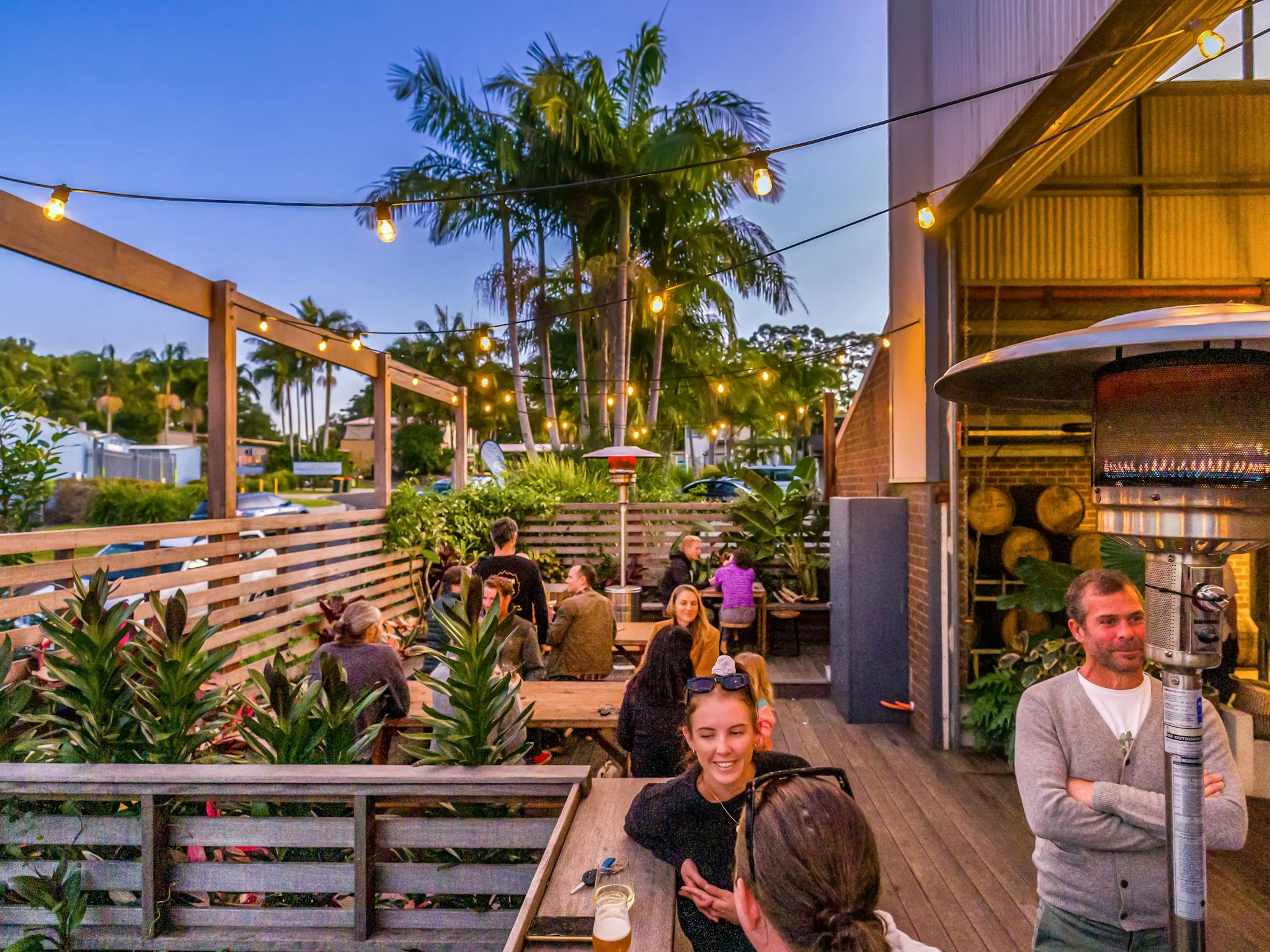 People enjoying beers on the deck of Common People Brewing Co during the winter months