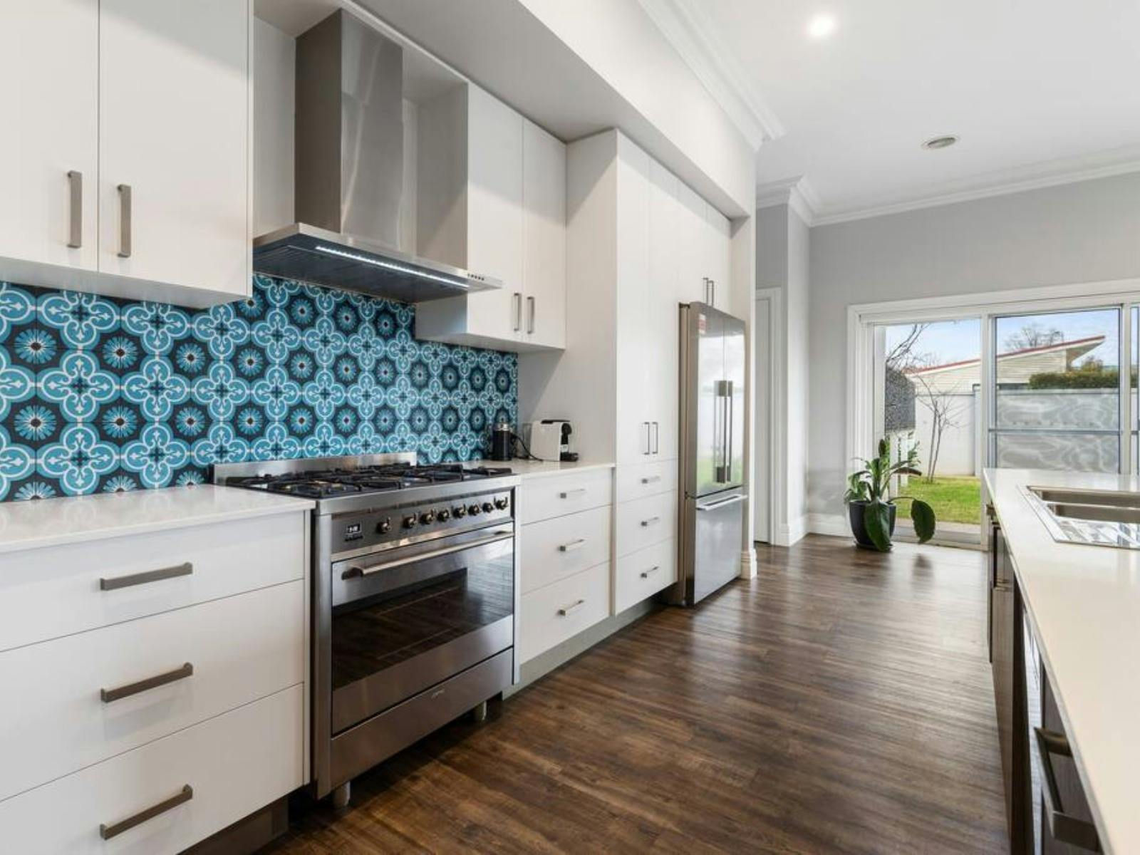 Large island bench and open living area.