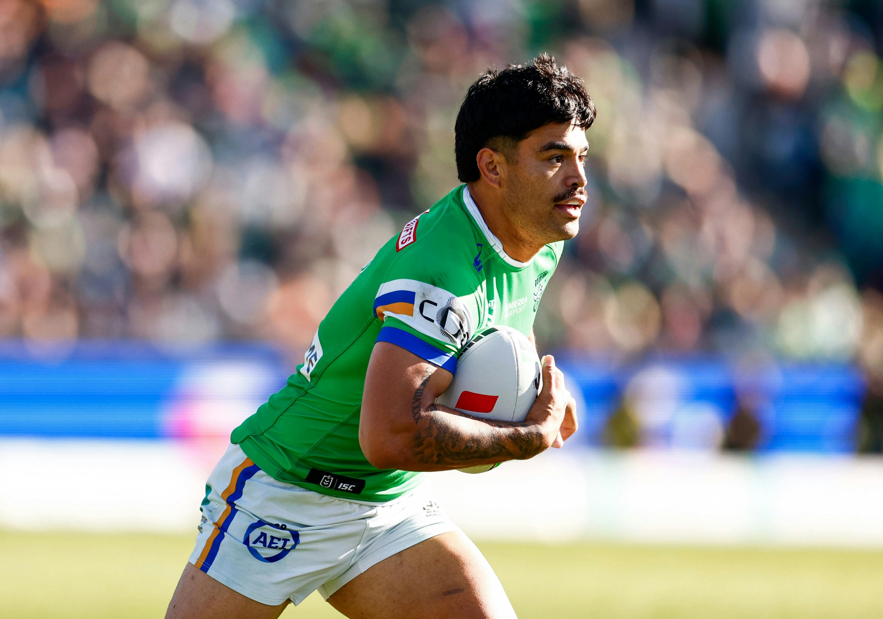 Canberra Raiders player Matthew Timoko running the ball.