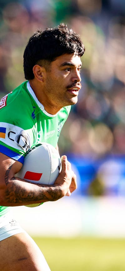 Canberra Raiders player Matthew Timoko running the ball.