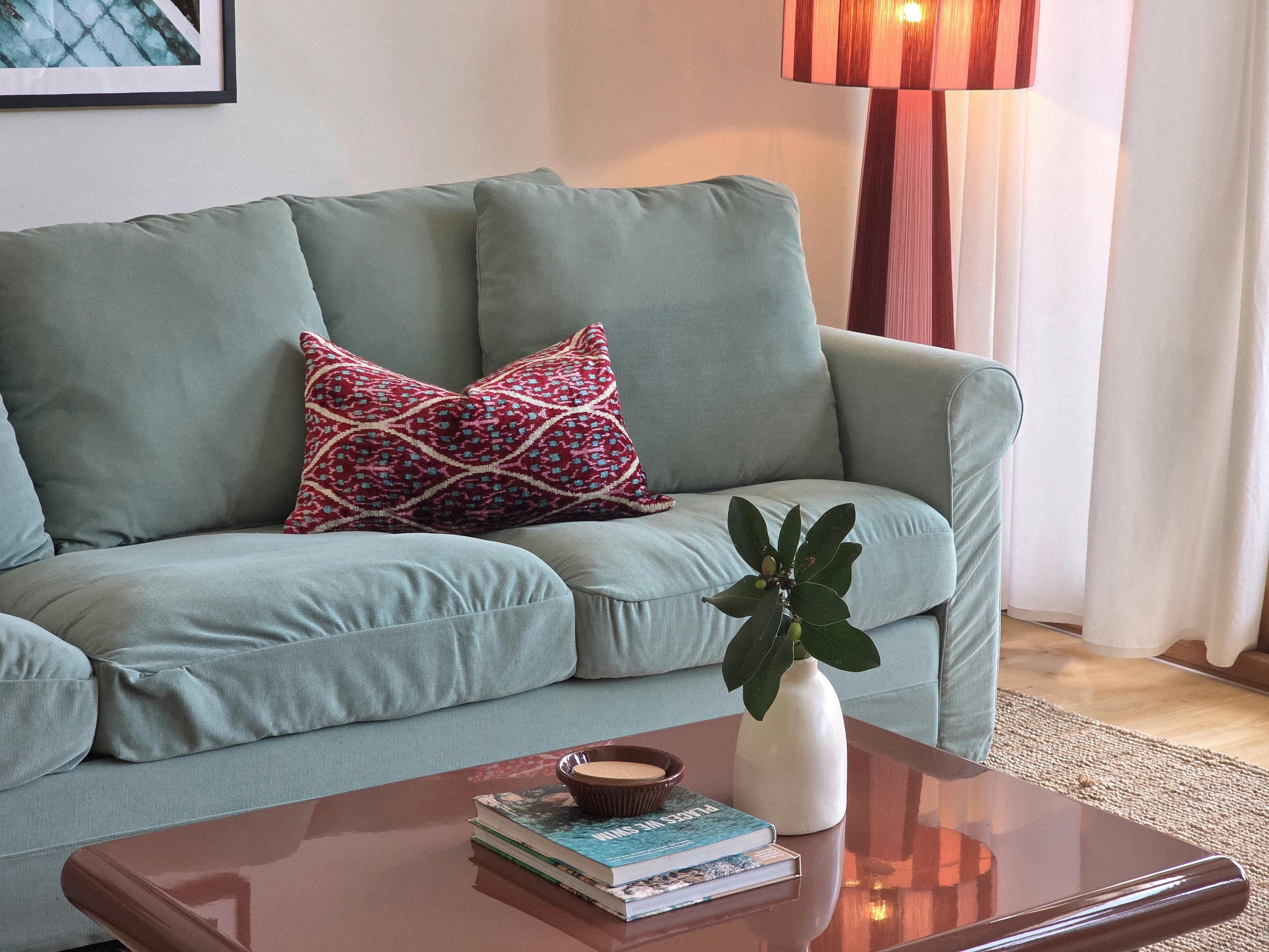 The open plan living space features comfortable stylish furniture, views and access to the deck