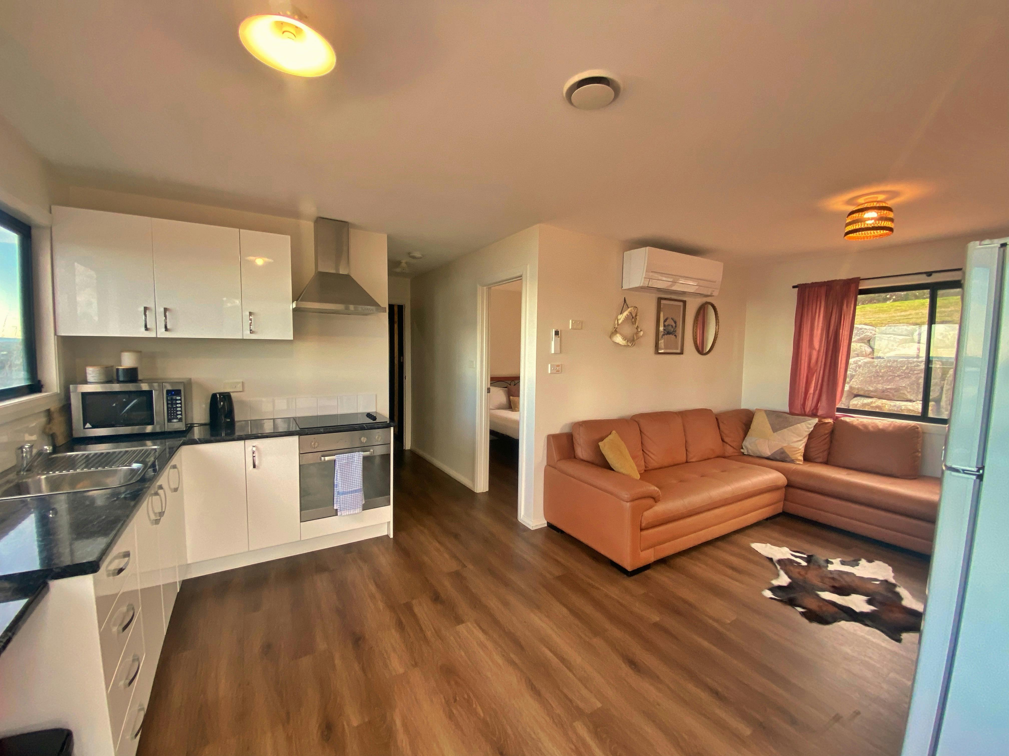 Kitchen and lounge with large modular sofa
