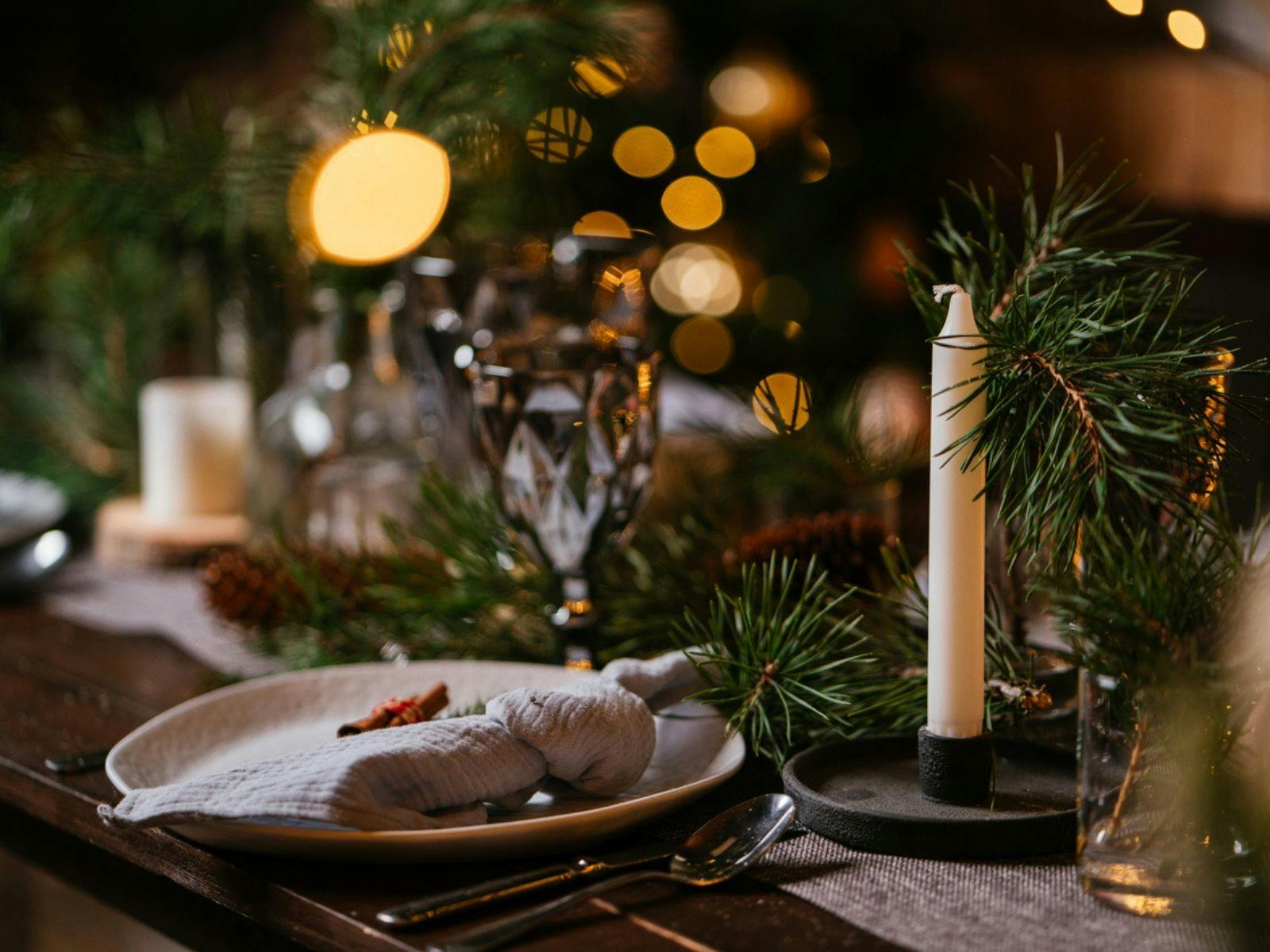 Rustic Christmas-themed plating and decoration on a wooden dining table
