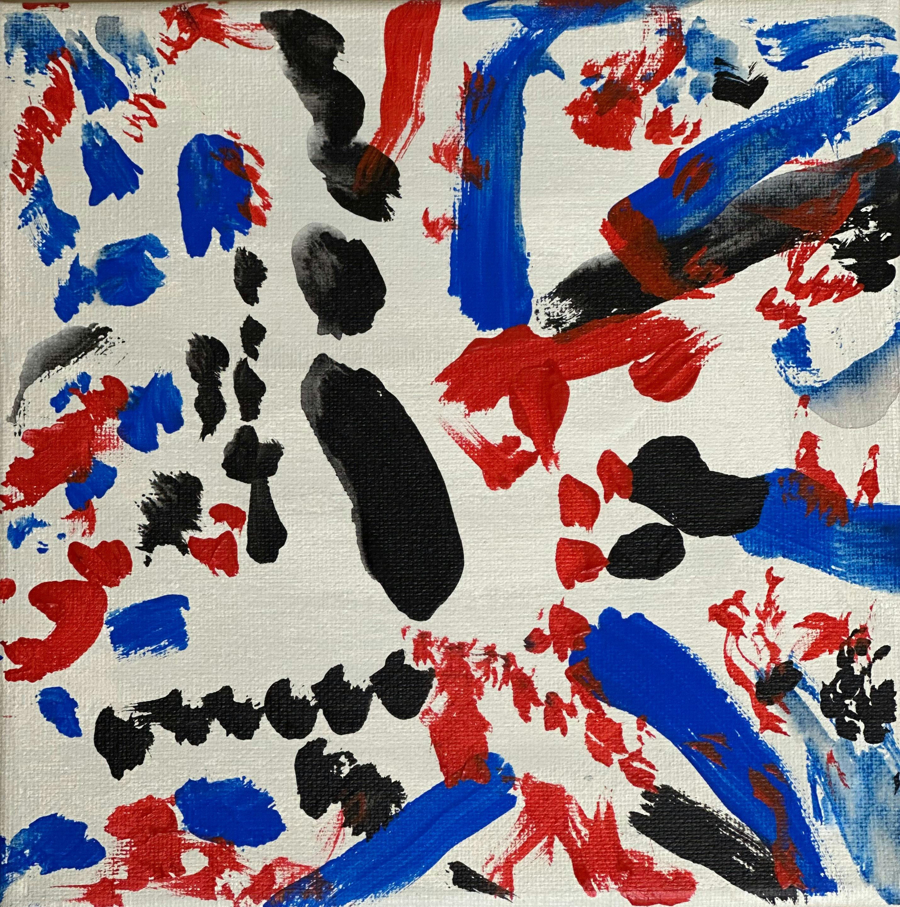 Blue, red and black markings on a white background creating an abstract work.