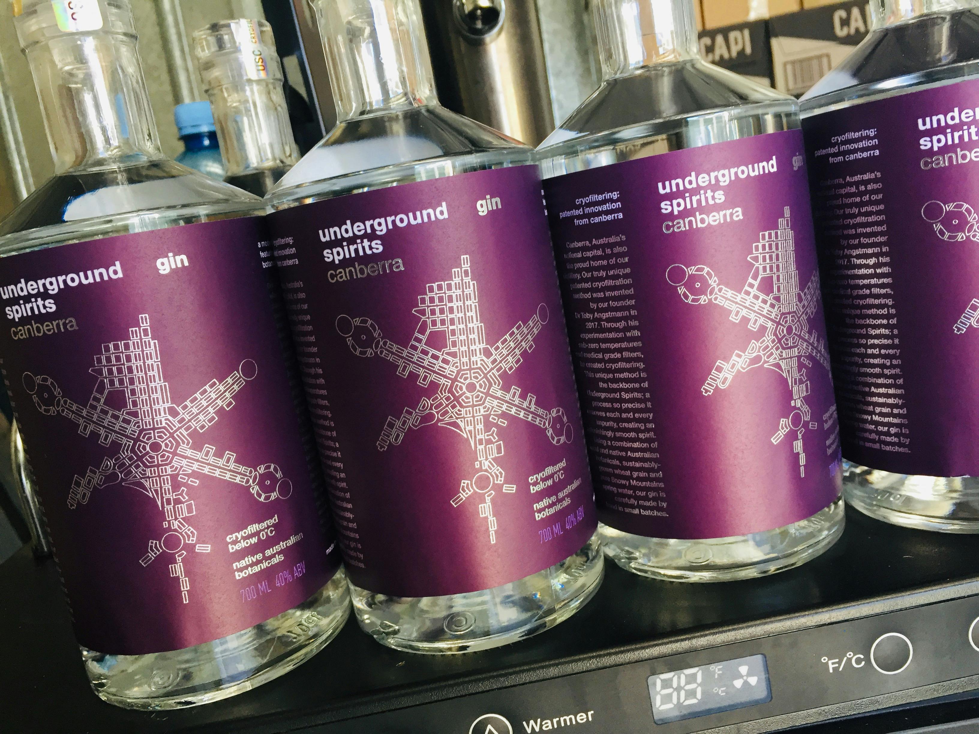 A row of Underground Spirits Gin bottles at the distillery