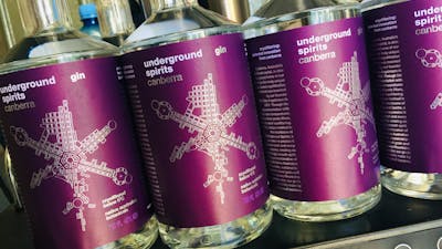 A row of Underground Spirits Gin bottles at the distillery