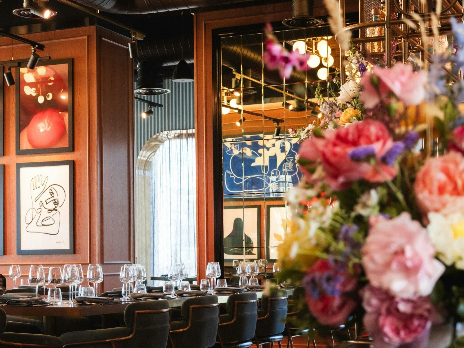 Restaurant beautifully decorated with flowers.