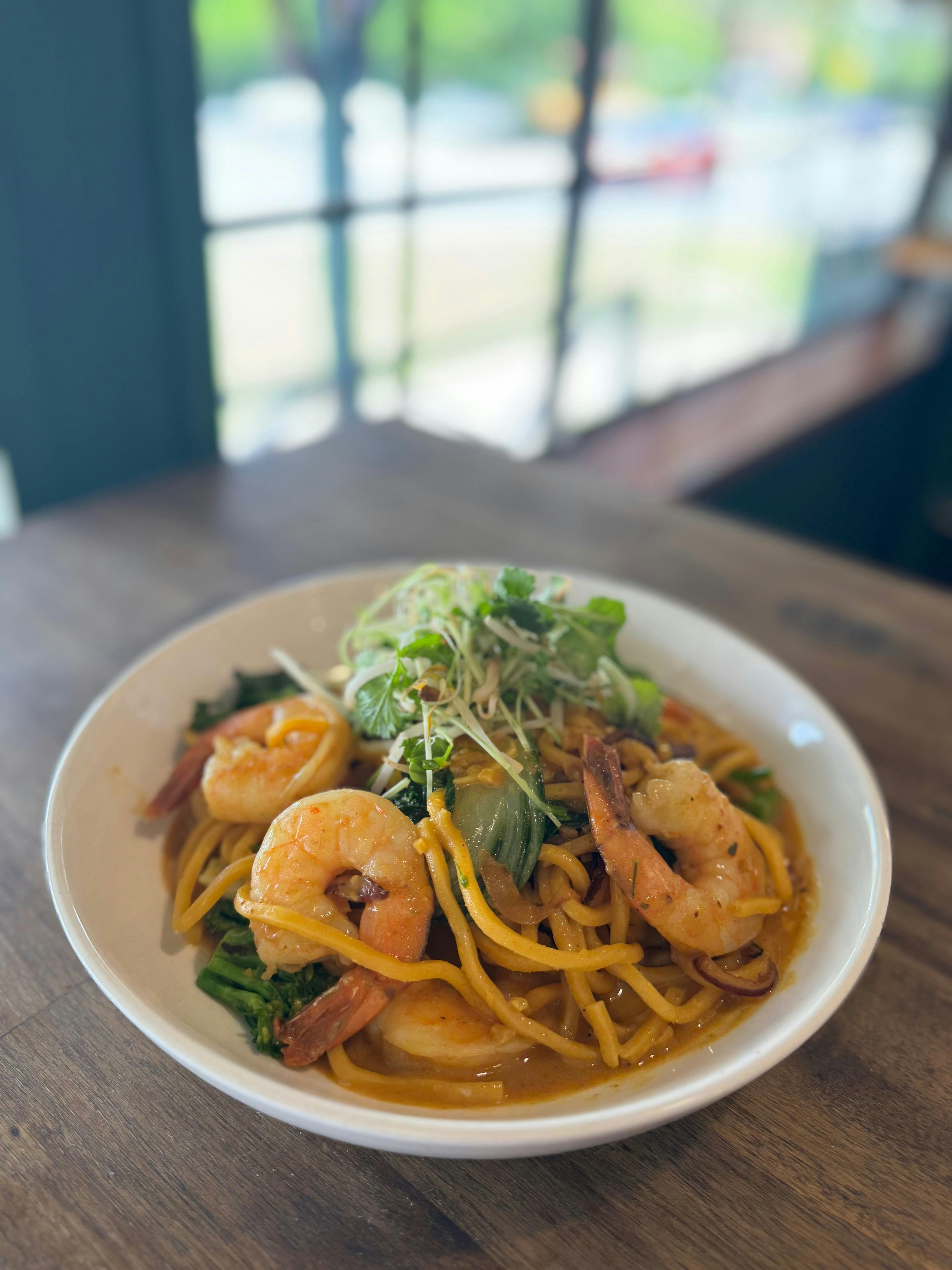 Prawns, red onion, broccolini, bok choy, noodles in a satay sauce