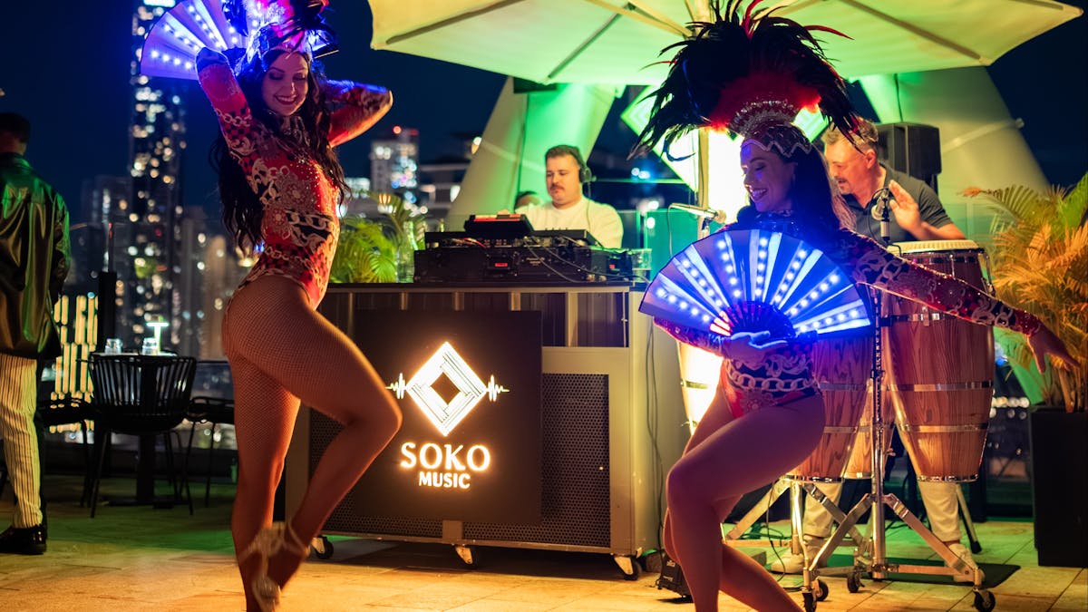 Two women dancing samba on the rooftop of Soko Two women dancing samba on the rooftop of Soko