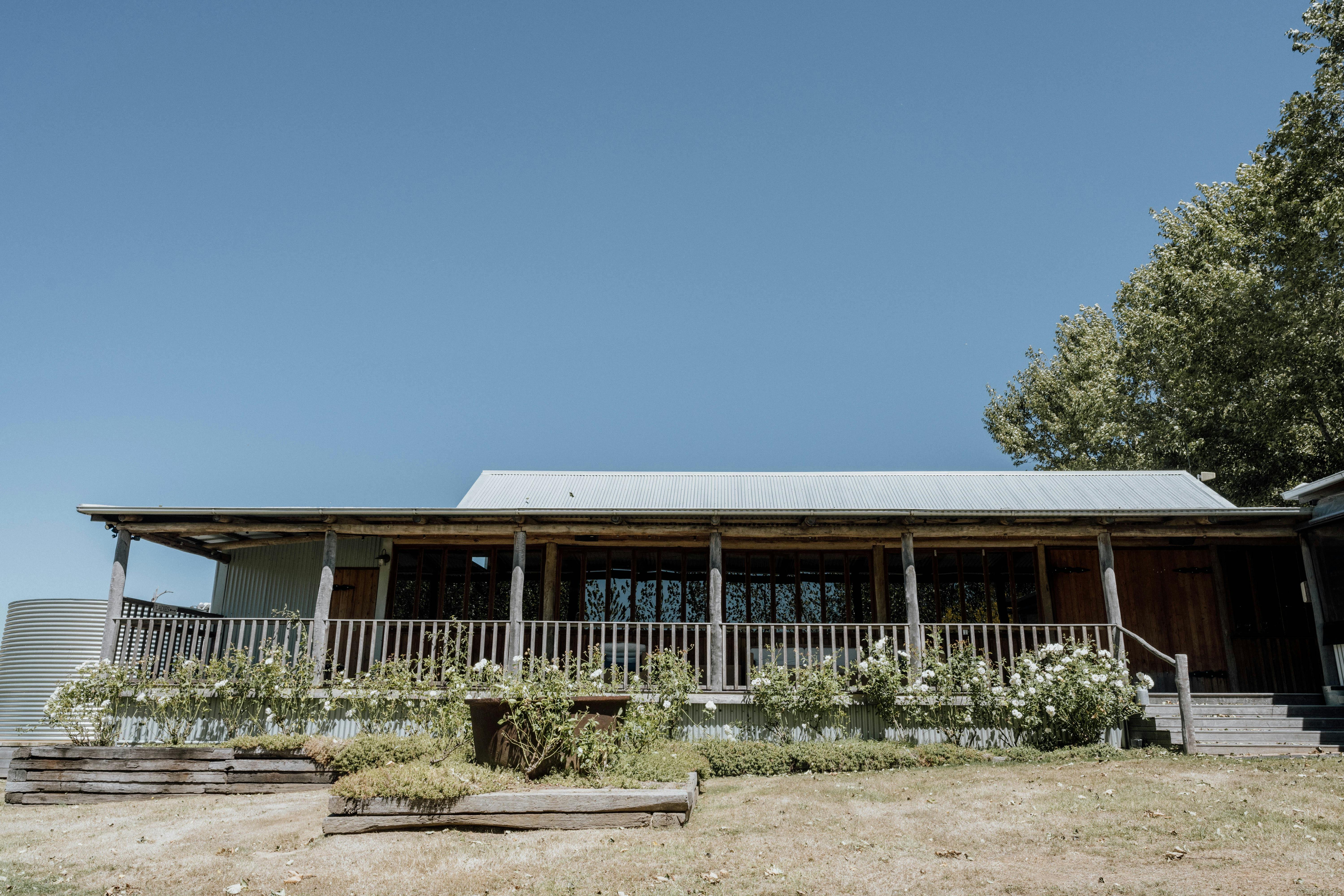 The barn exterior day tennis court side