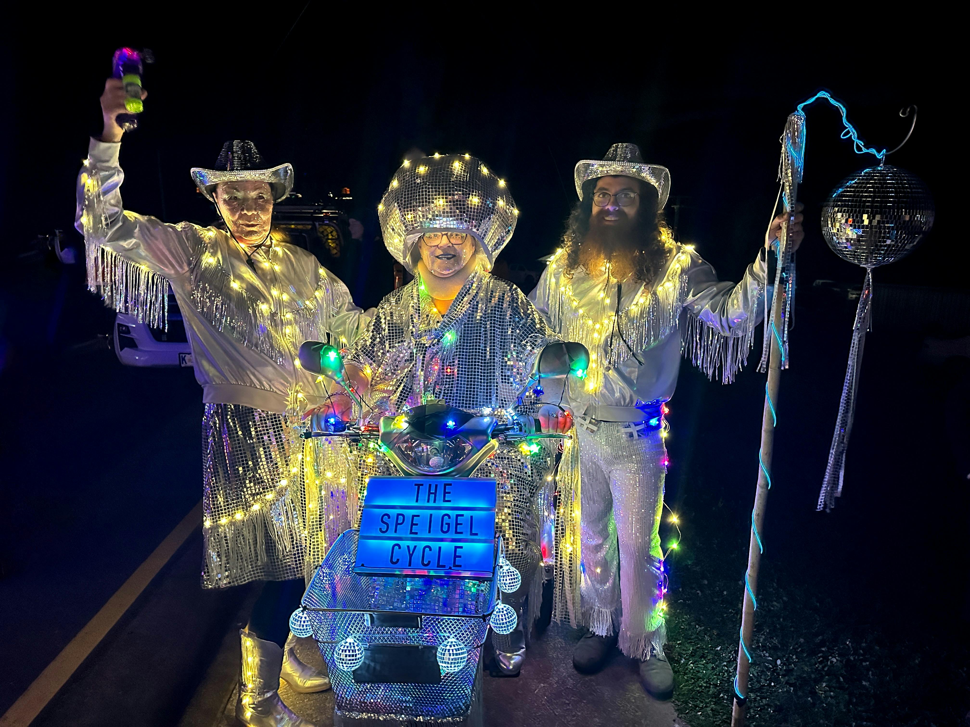 Three silvery humans shine