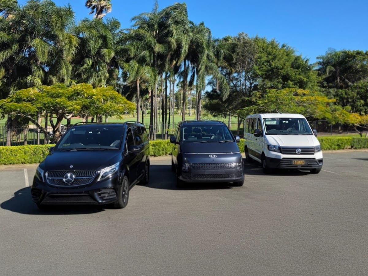 GEC Transfers fleet featuring Mercedes-Benz, Hyundai Staria, and Volkswagen vans lined up outdoors.