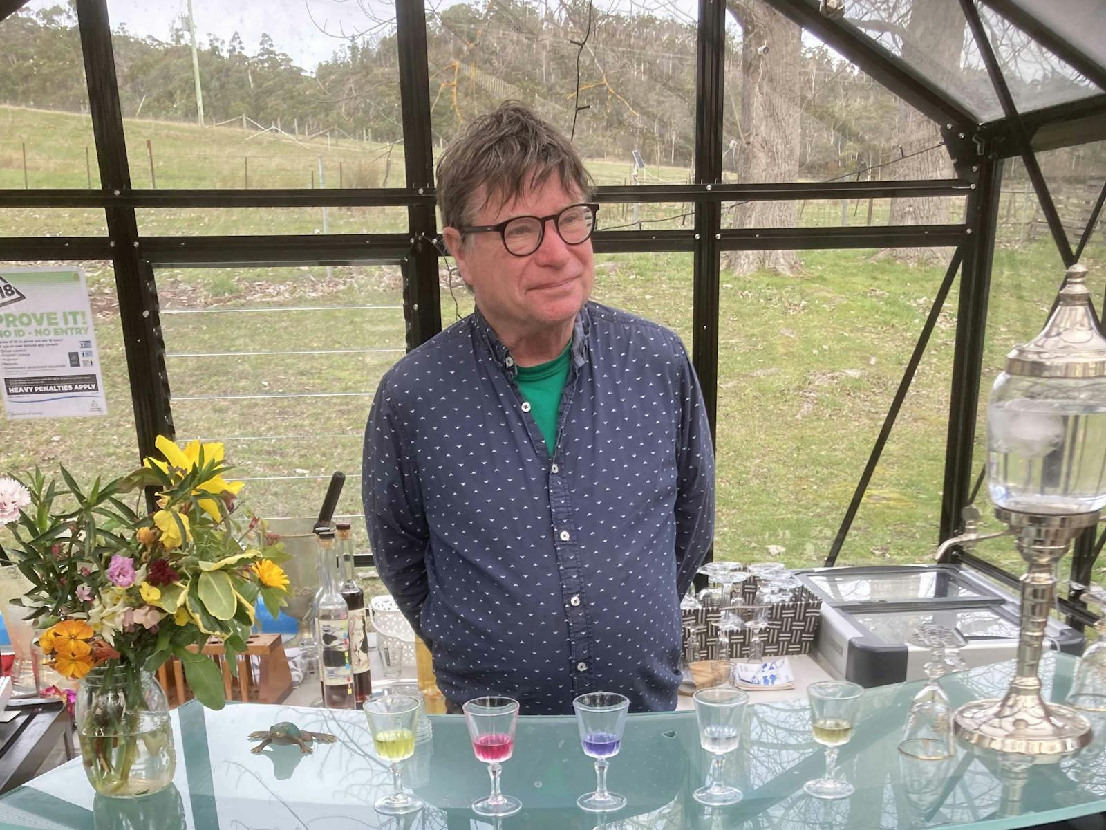 Distiller in his glasshouse cellar door