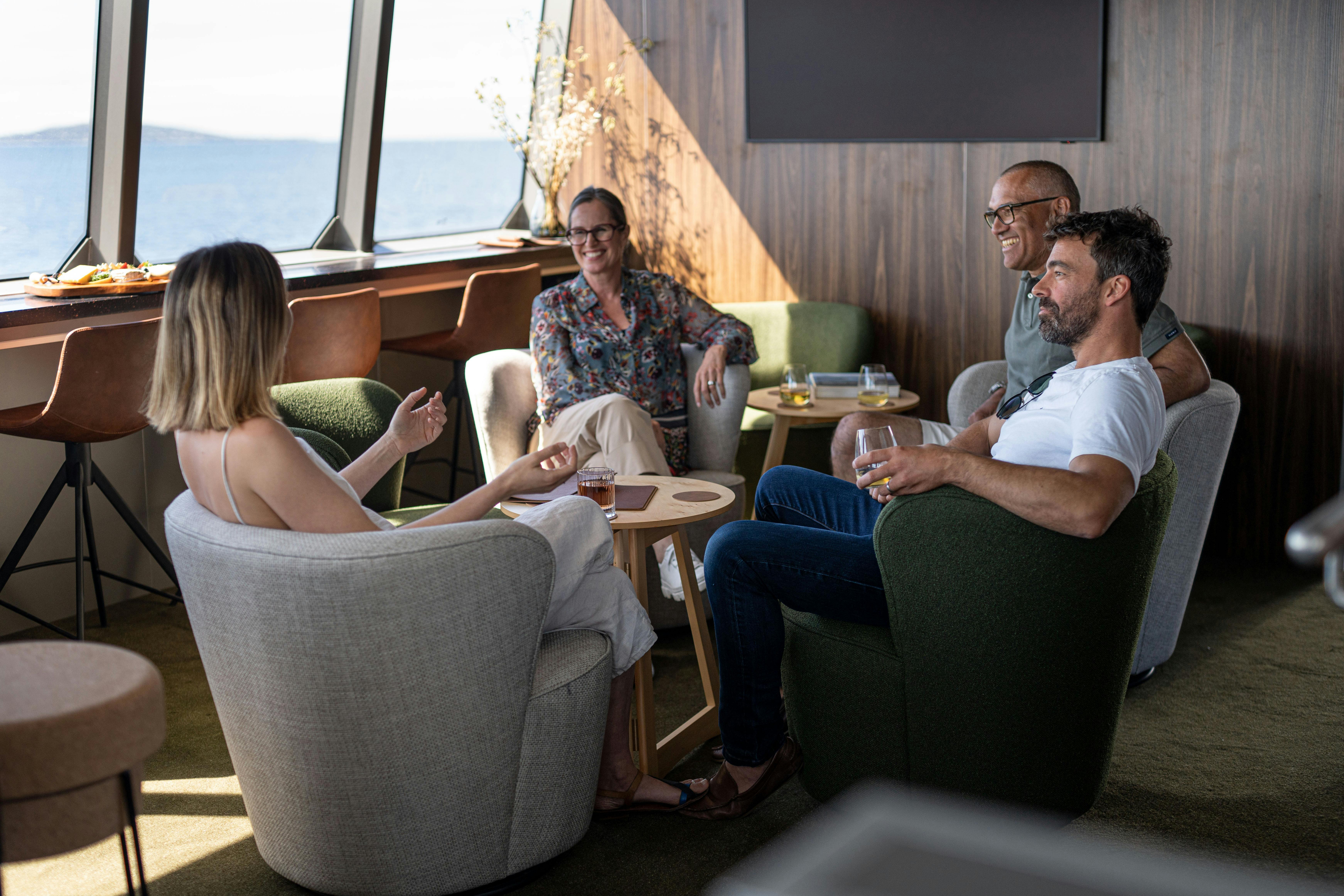 Guests relaxing in expedition vessel Odalisque's Wheelhouse Lounge & Bar