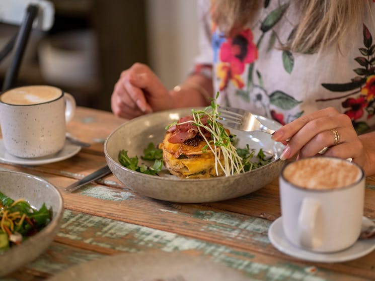 Woman eating a meal at Red Door Cafe