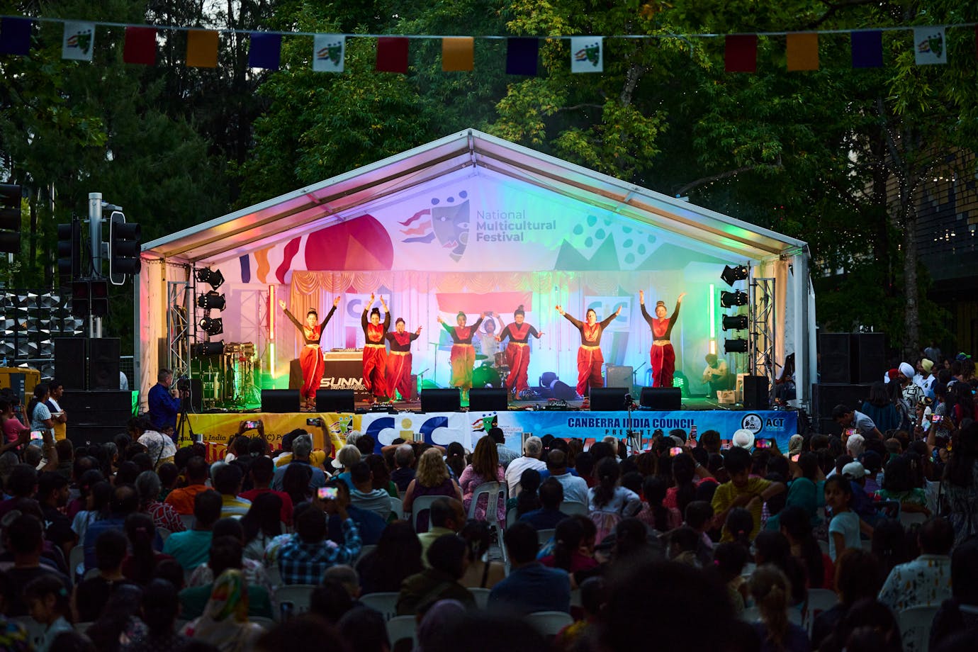 A group of women dancing on stage at the festival
