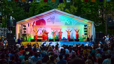 A group of women dancing on stage at the festival