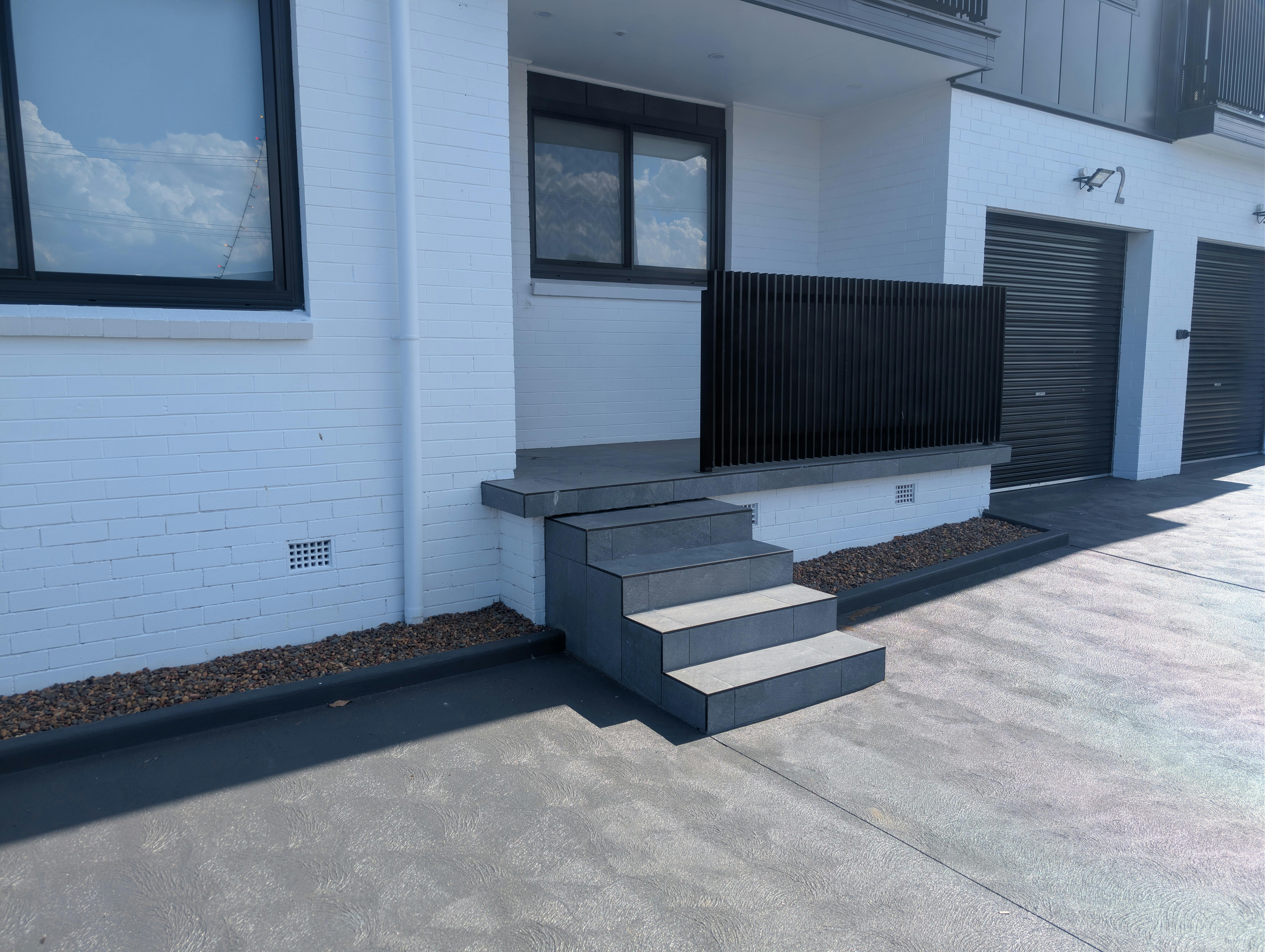 Front Access to One Bedroom With Garage Apartments.