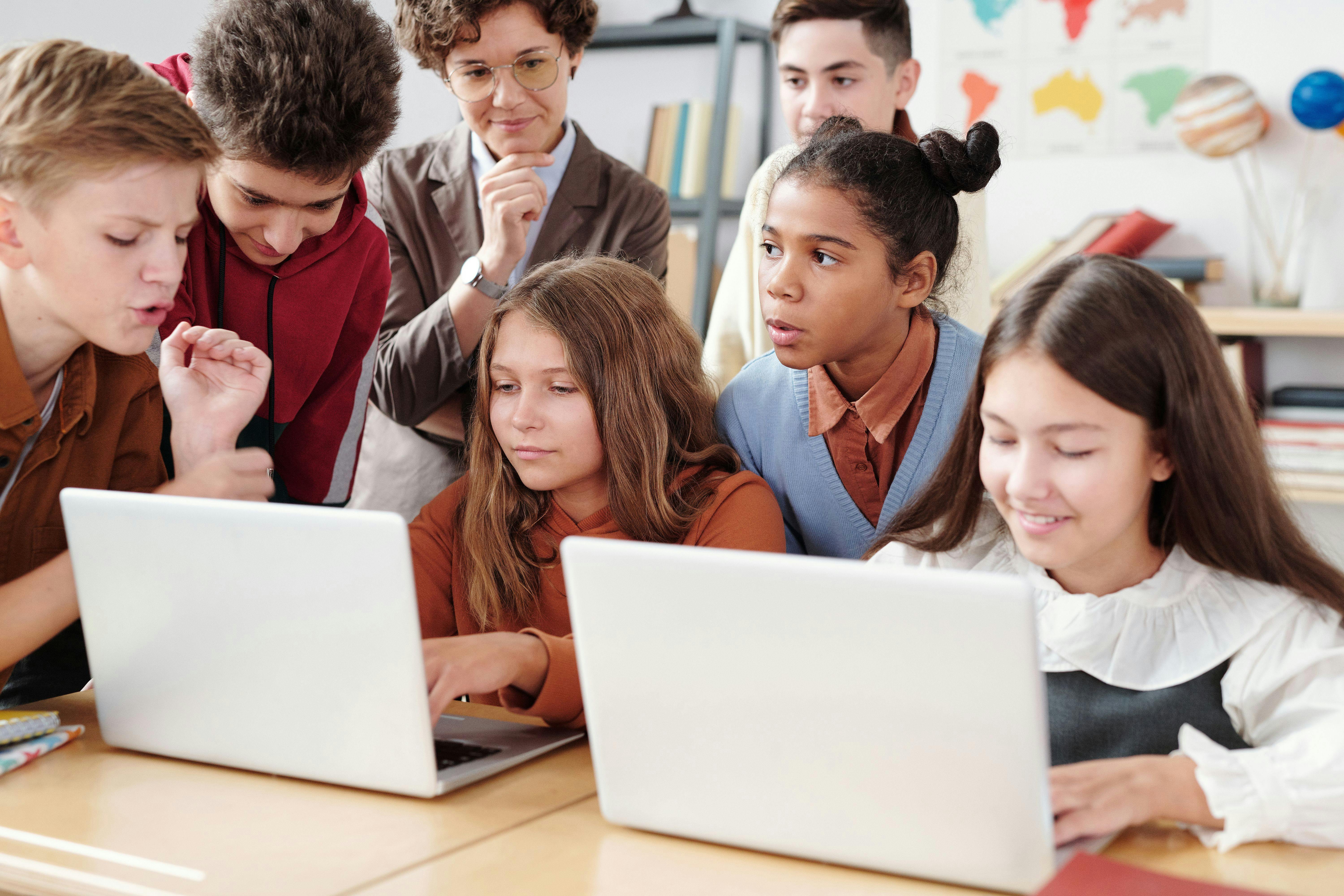 Children working together to code an app