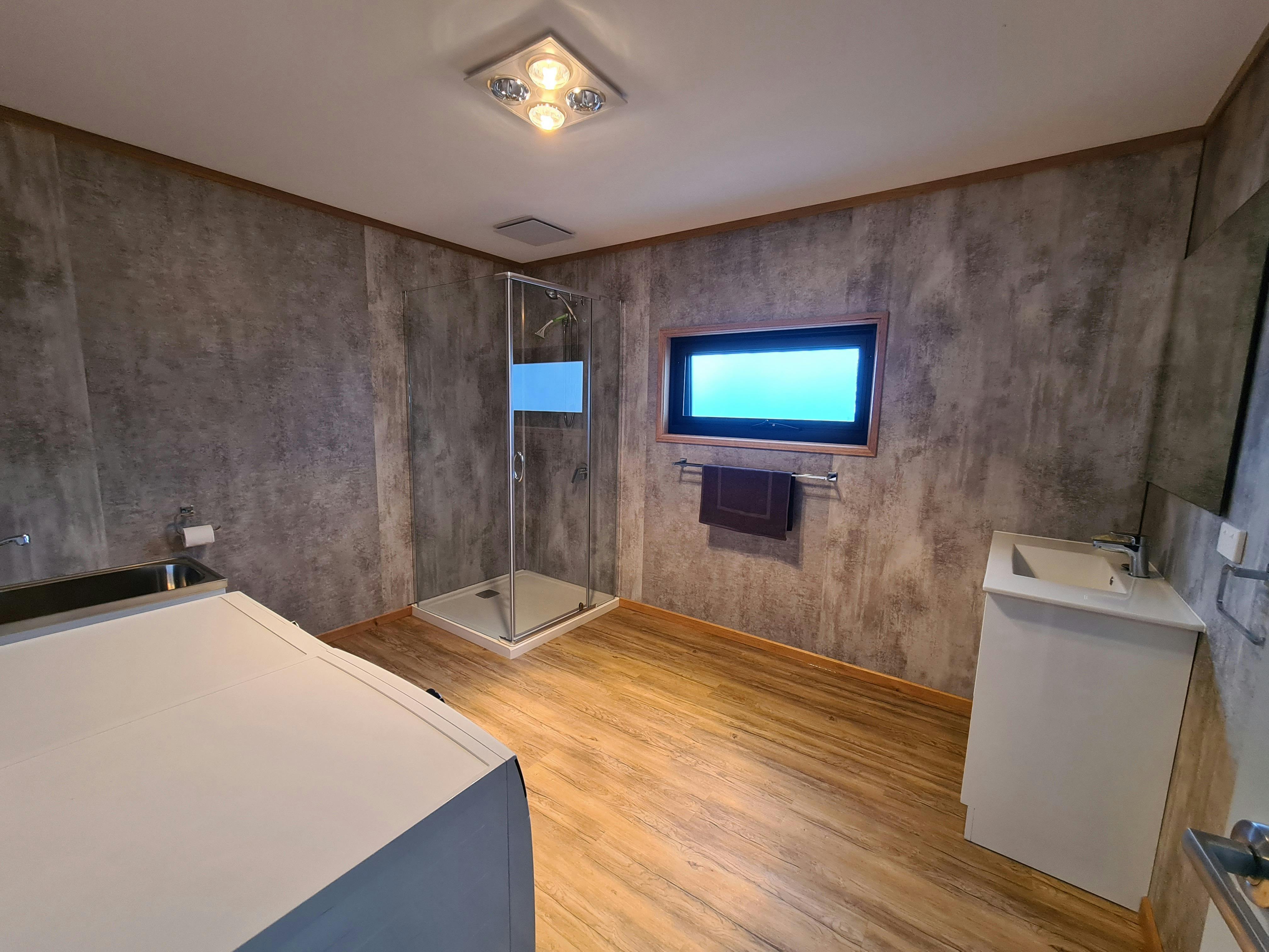 Modern bathroom with shower and timber features