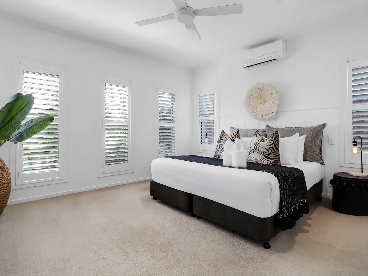 Main bedroom with walk-in robe, ensuite bathroom and king bed