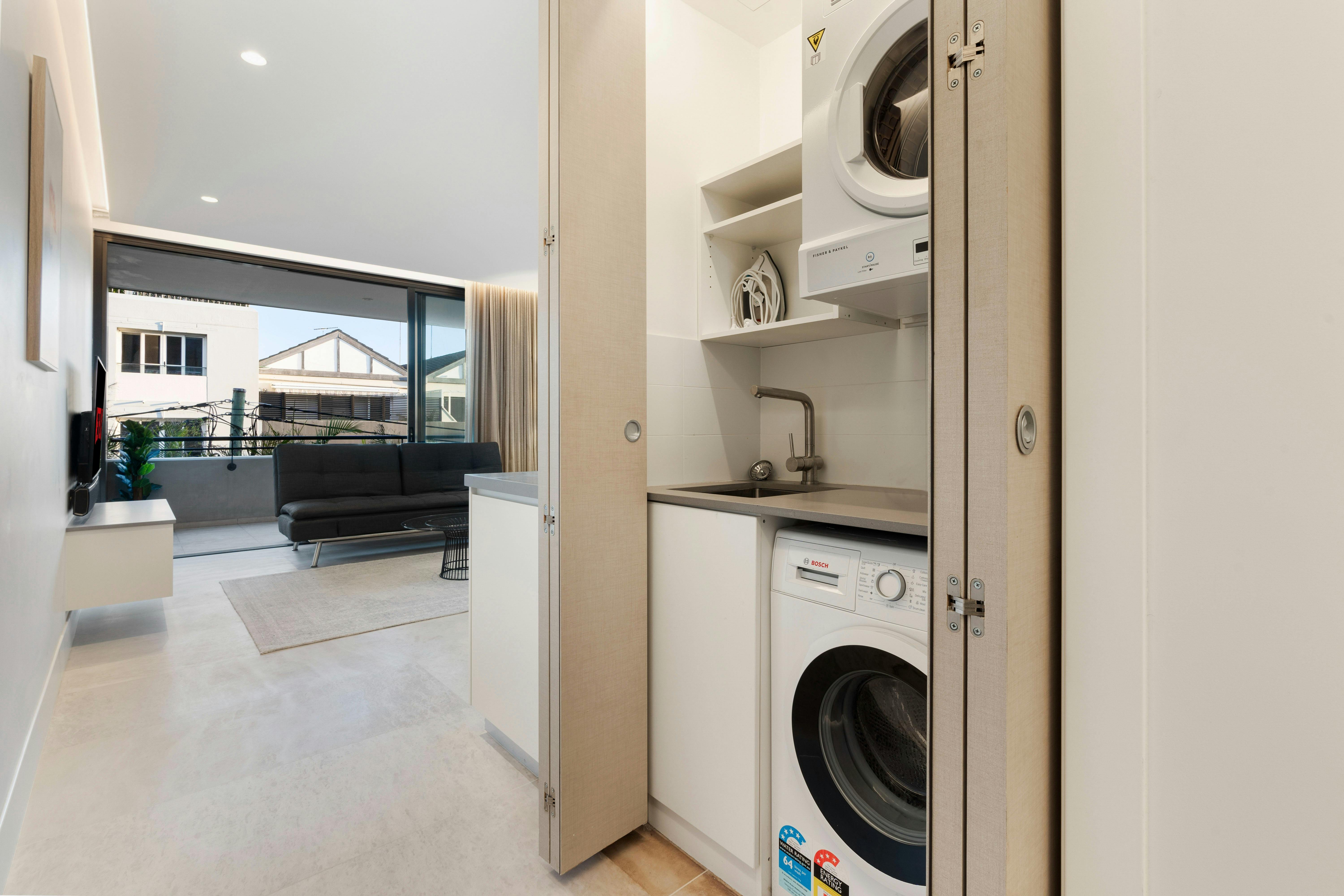 Bright living room with comfy seating and a view of the city.