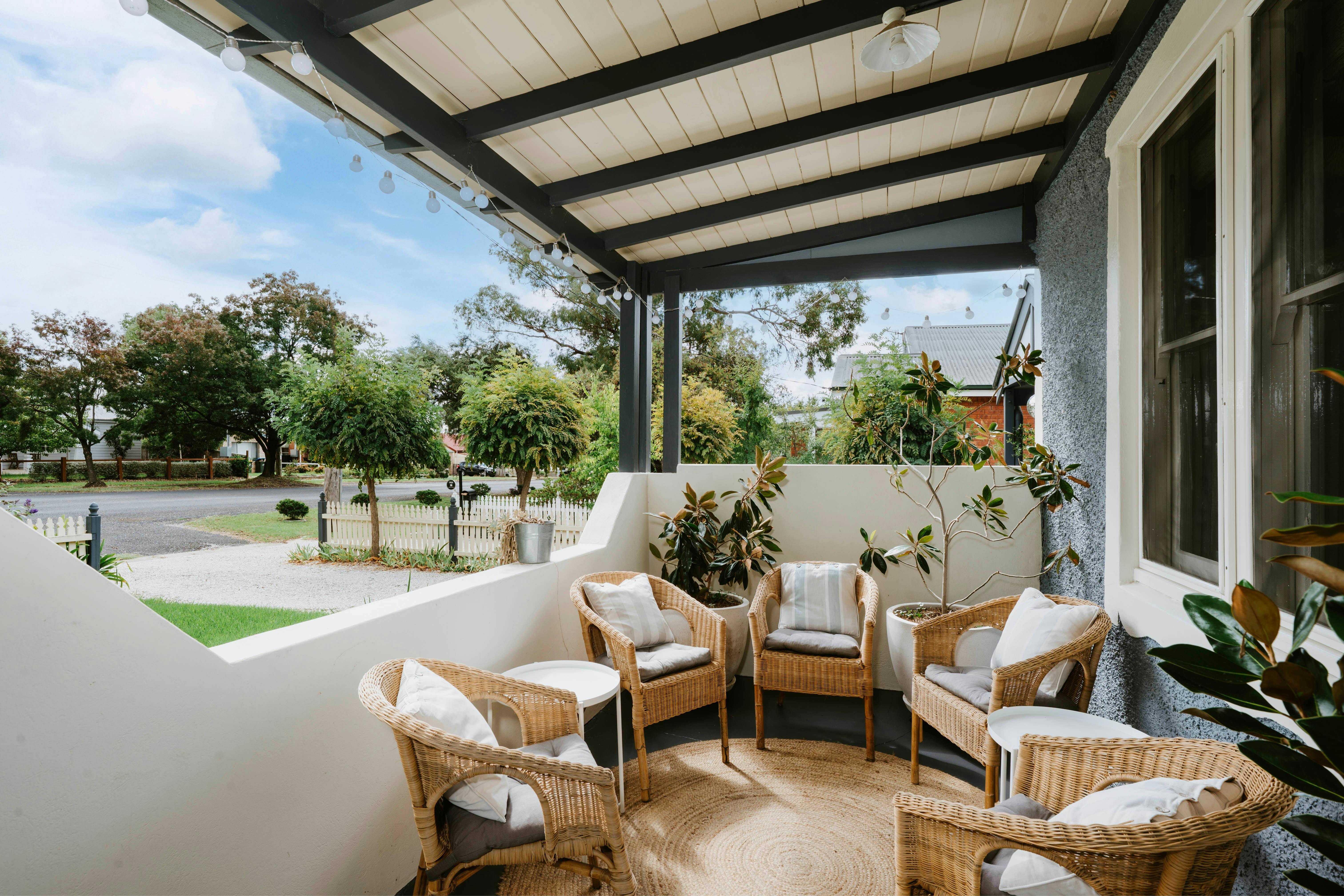Relax on the front porch with seating & tables