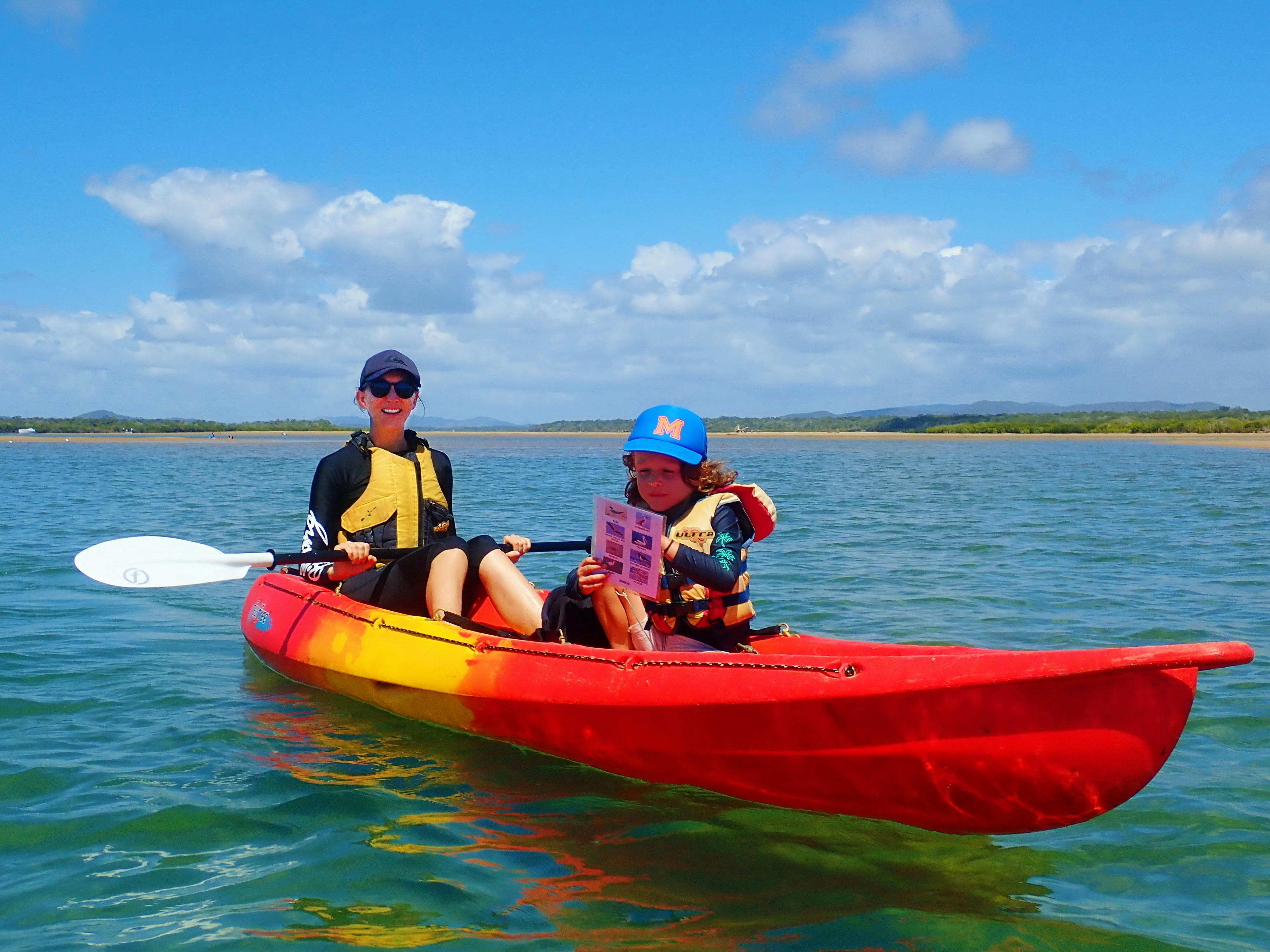 Mother and son in a double kayak