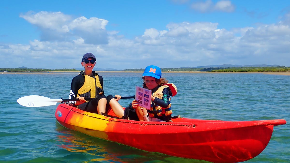 Mother and son in a double kayak